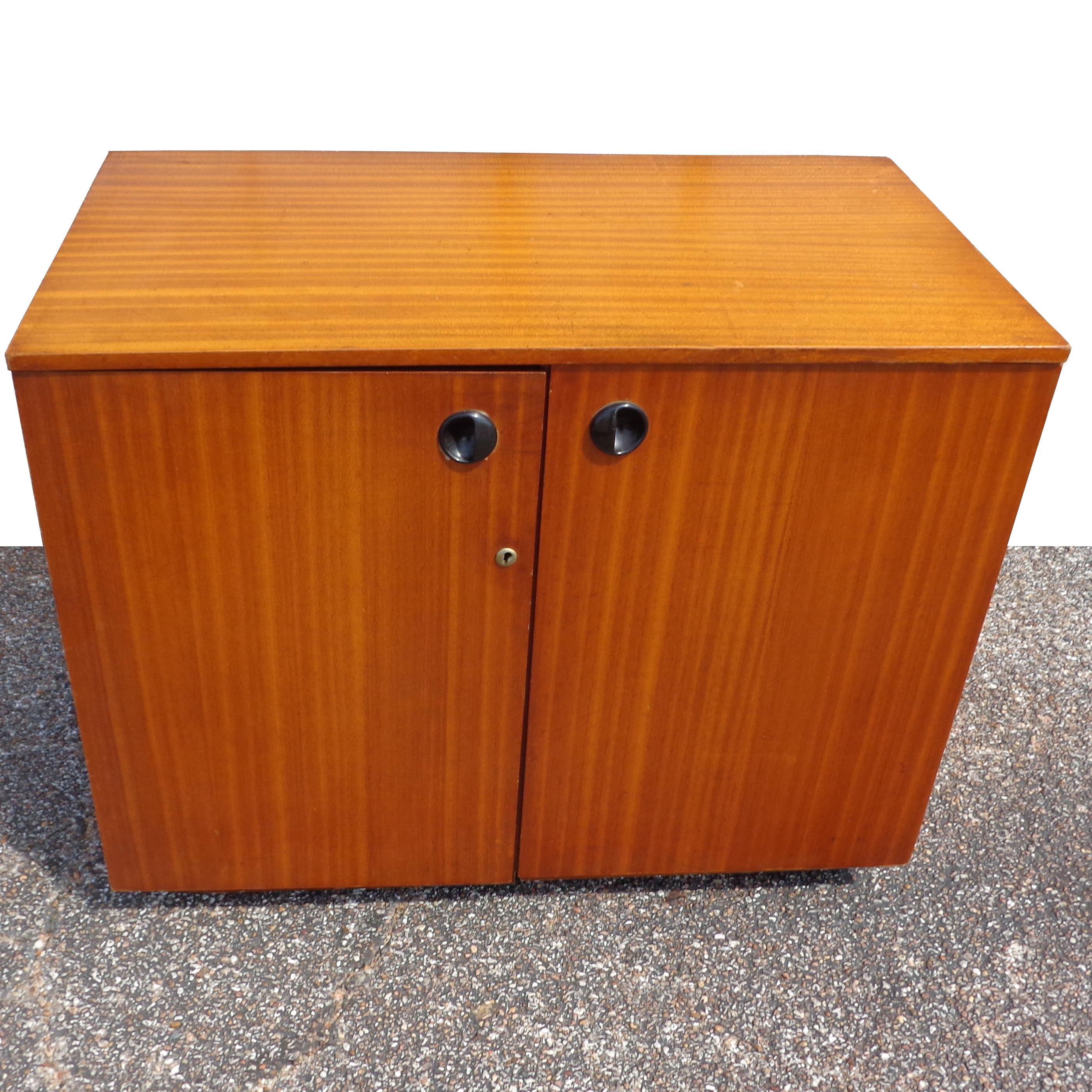 Mid Century foldable desk

This space saving folding desk or office unit from the 1960's was expertly crafted of teak in England.
When open, features closed and open cabinets, file storage and partitioned drawer.
 Black laminate work surface.