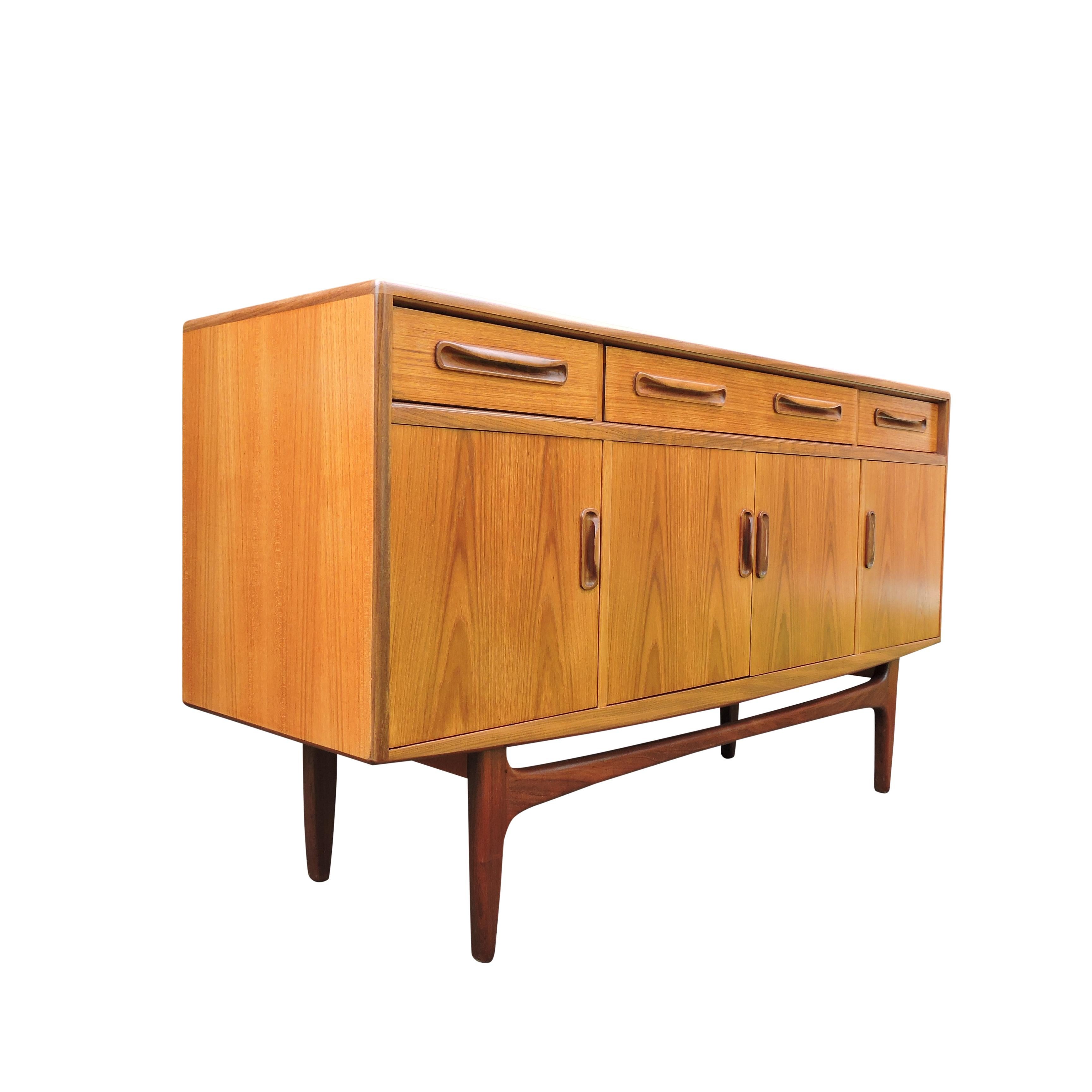 A fresco teak 1960s G-Plan sideboard which features three drawers and four cupboards.