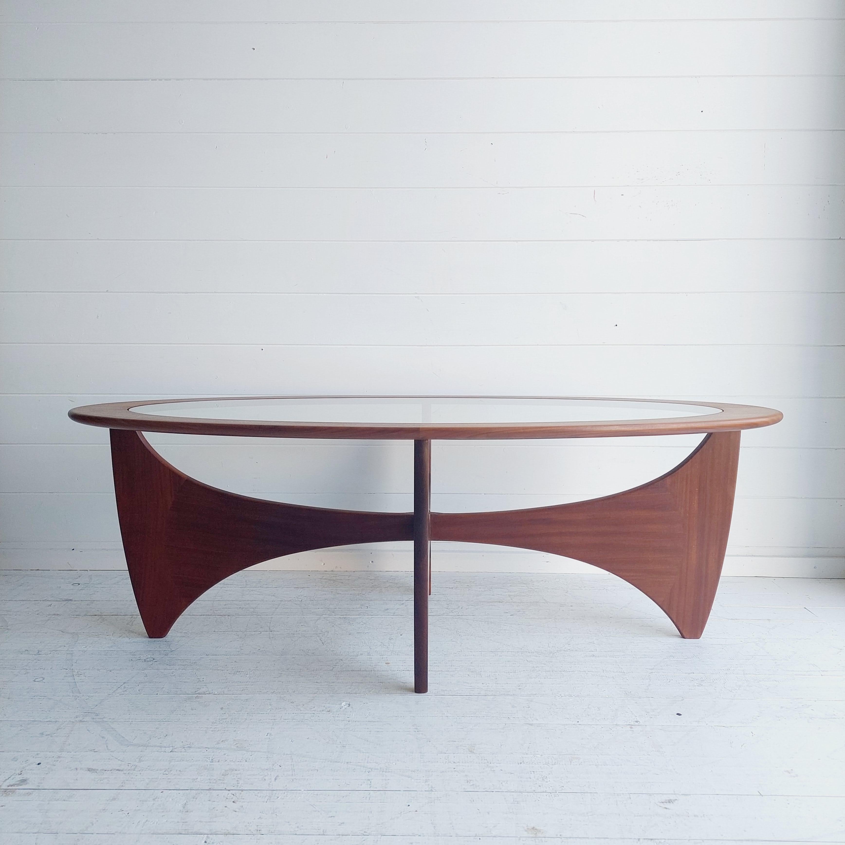 Mid century British teak and glass  Astro coffee table designed by Victor Wilkins for G Plan in the 1960s / 70s.
This restored piece is the oval shape which is harder to find.
This piece has a solid teak base (inspired by Isamu Noguchi ) complete