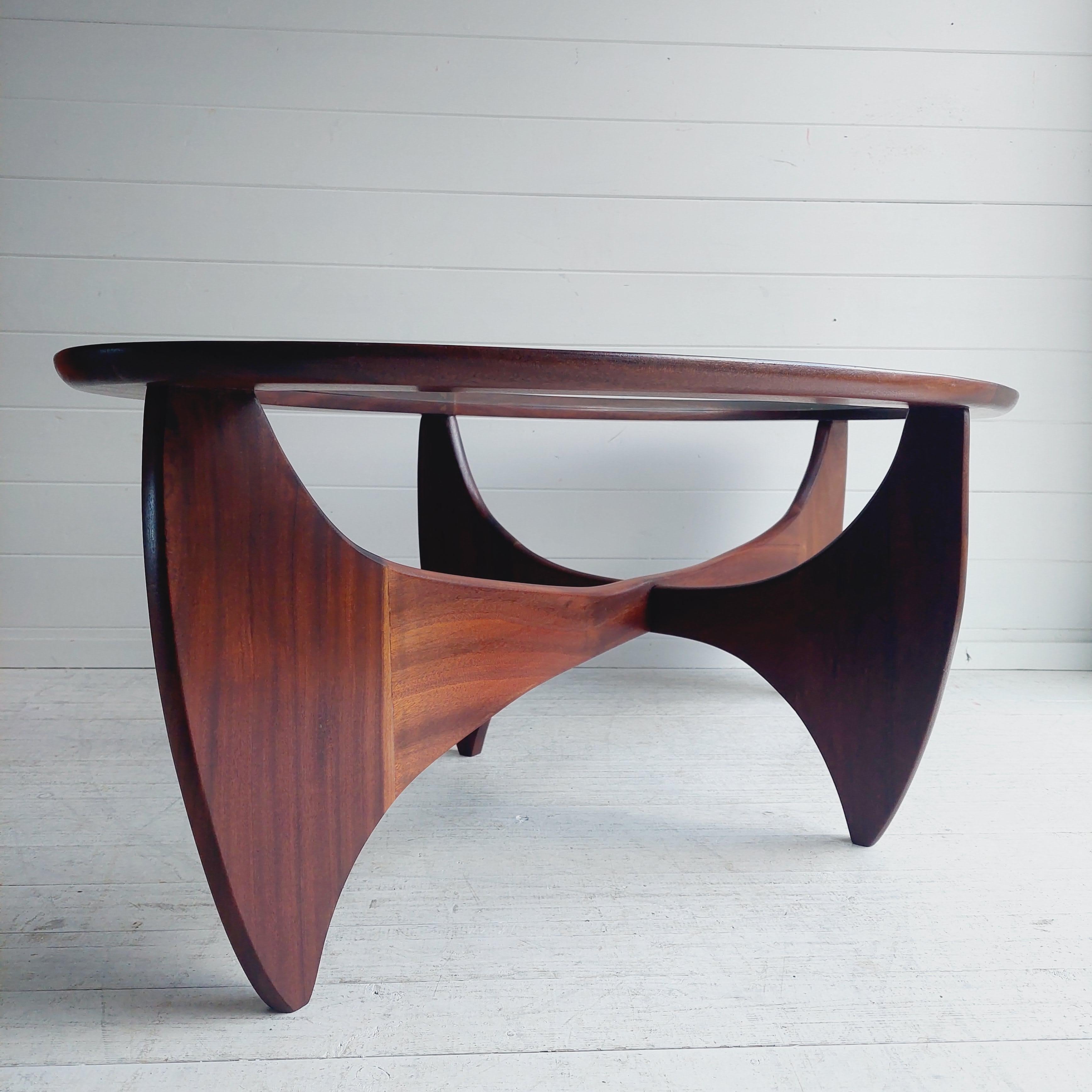 Mid century British teak and glass  Astro coffee table designed by Victor Wilkins for G Plan in the 1960s / 70s.

This restored piece is the oval shape which is harder to find.
This piece has a solid teak base (inspired by Isamu Noguchi ) complete