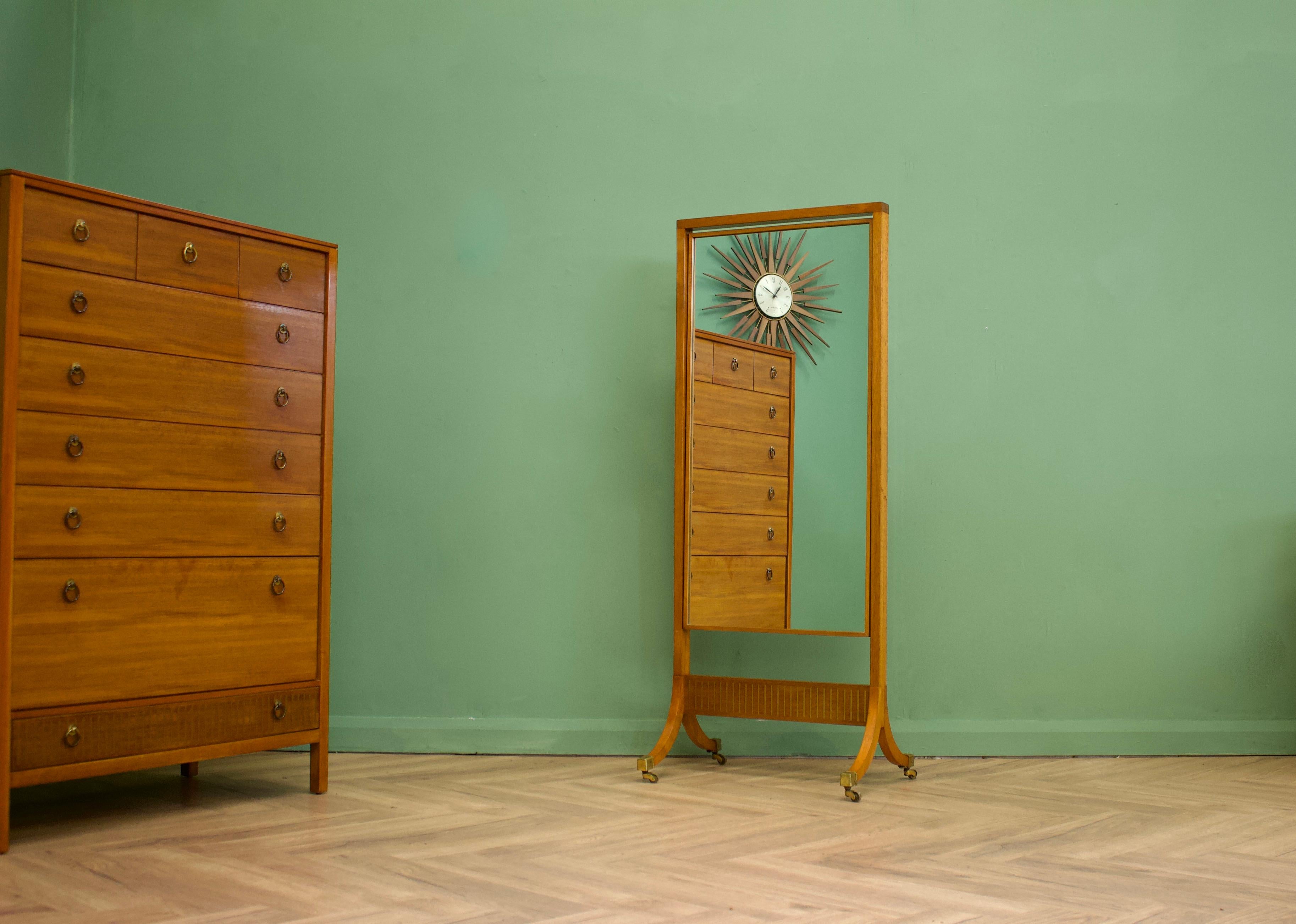 A teak & mahogany dressing table from Loughborough Furniture - retailed through Heals during the 1950s -  designed by Neville Ward and Frank Austin
This piece stands on slim legs and features three drawers - To them is unusual brass inlay details