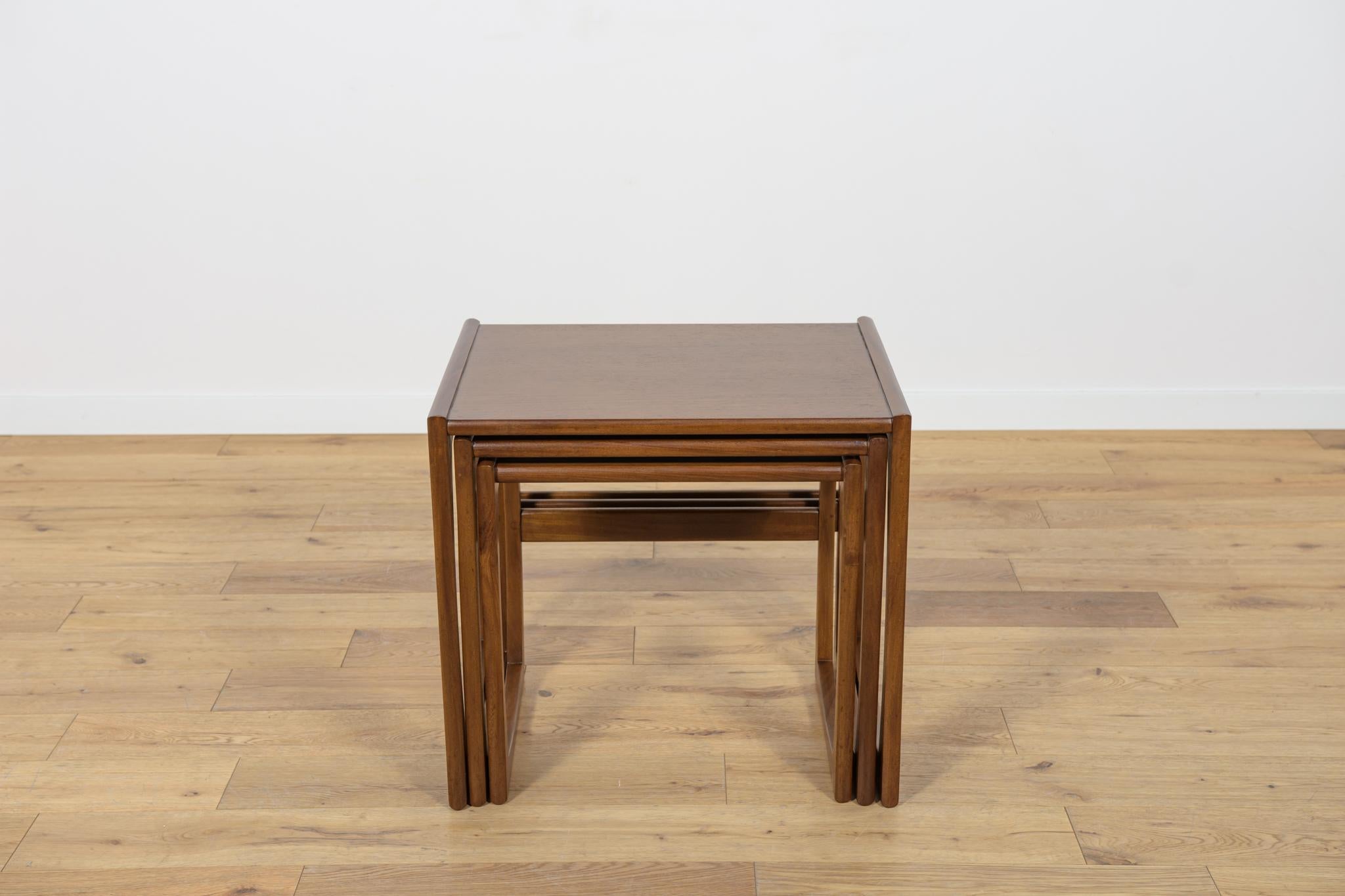 
This set of three pull out tables was designed by R. Benett for G-Plan. The teak elements have been cleaned old surface, polished and painted in an oak mordant and finished lacquer.
Big table: W 53 x D 43 x H 49.
Medium table: W 48 x D 42 x H