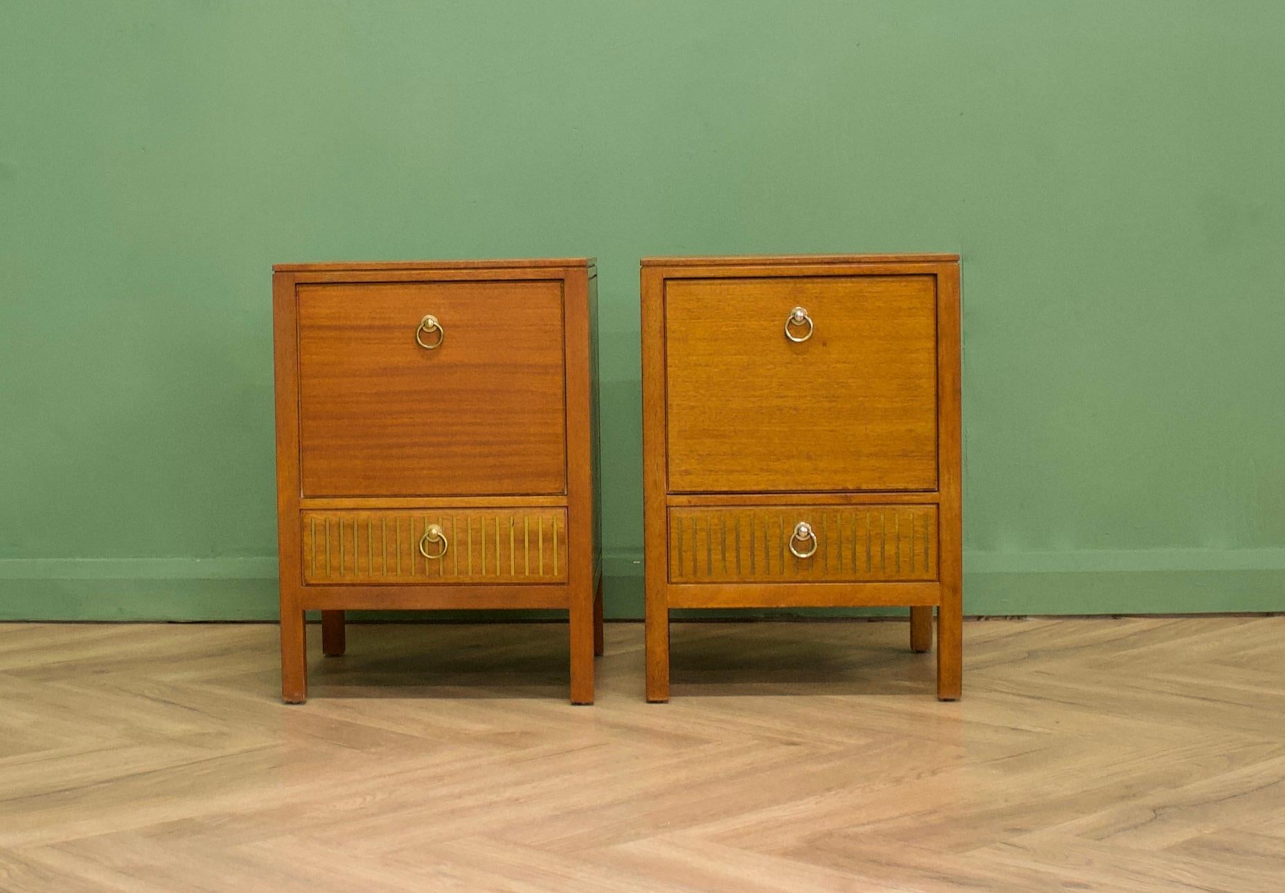 Teak & mahogany bedside tables from Loughborough Furniture - retailed through Heals during the 1950s - designed by Neville Ward and Frank Austin
There are unusual brass inlay details to the bottom
These can be used as a lamp or side tables also
