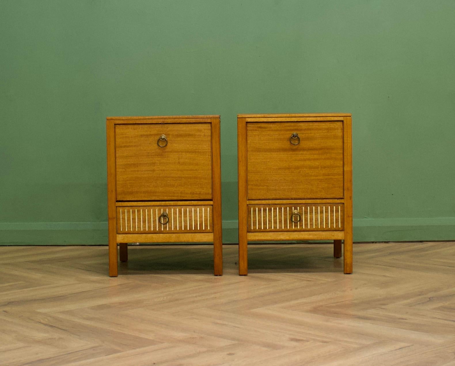 Teak & mahogany bedside tables from Loughborough Furniture - retailed through Heals during the 1950s - designed by Neville Ward and Frank Austin
There are unusual brass inlay details to the bottom
