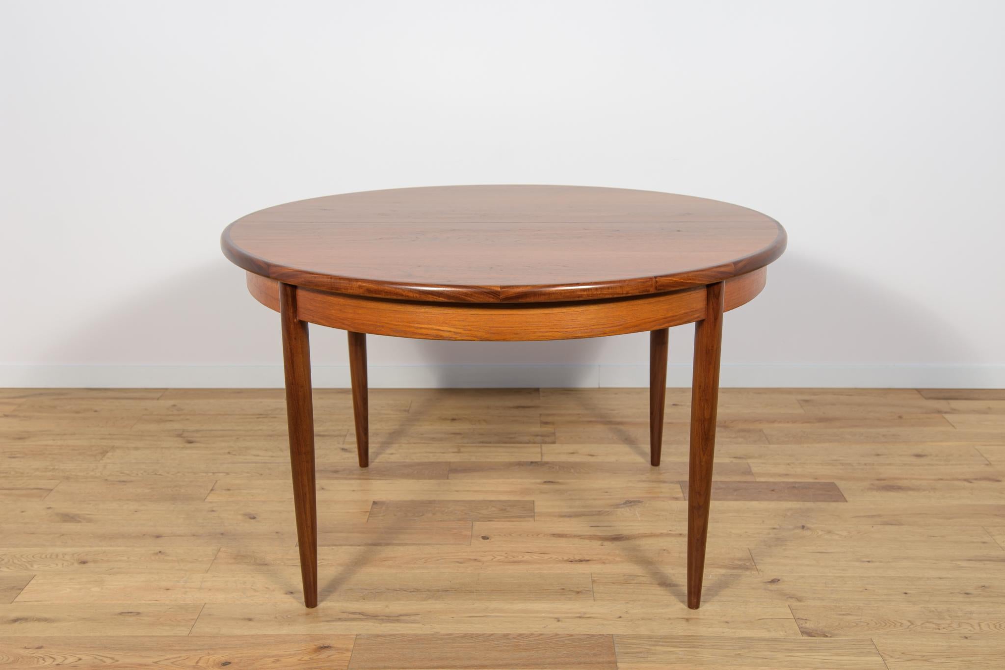 This round extendable dining table was produced by british G-Plan in the 1960s. The table has profiled reinforced edges of the top. Teak elements cleaned old coating and  finished very quality danish oil. The table has a mechanism that facilitates
