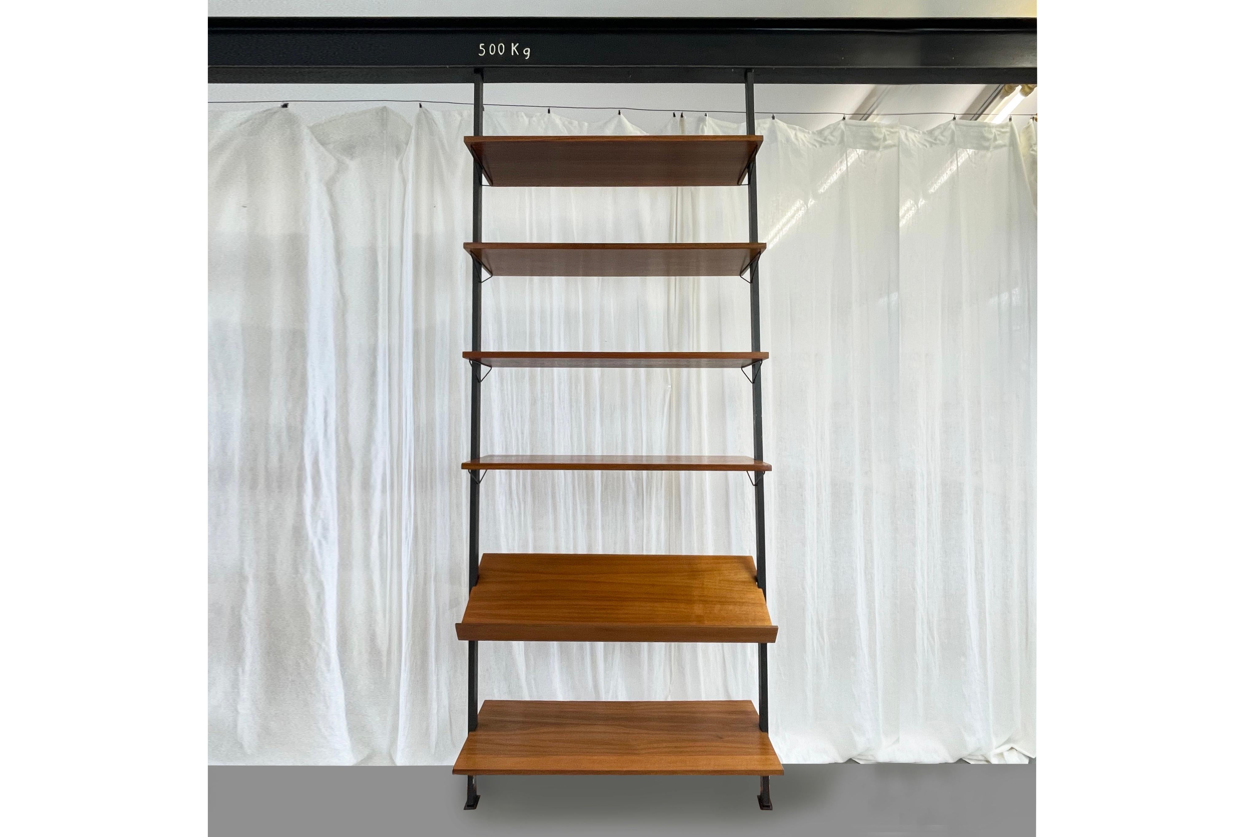 Mid-Century Sweden, modular shelving system by Olof Pira made of metal & teak veneer.

Manufacturer: Pira, Plan Möbel.
Fantastic design, minimalist, mid-century classic.
A total of 6 teak veneer shelving panels, one of which (here the lowest in the