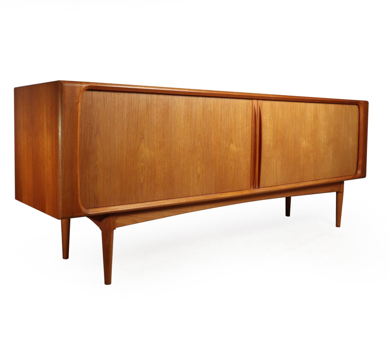 Midcentury teak sideboard By Bernhard Pederson, circa 1960
This Original, 1960s midcentury sideboard is by Bernhard Pederson for BPS furniture. It is Teak with tambour sliding doors, adjustable shelves and drawers and has solid construction and