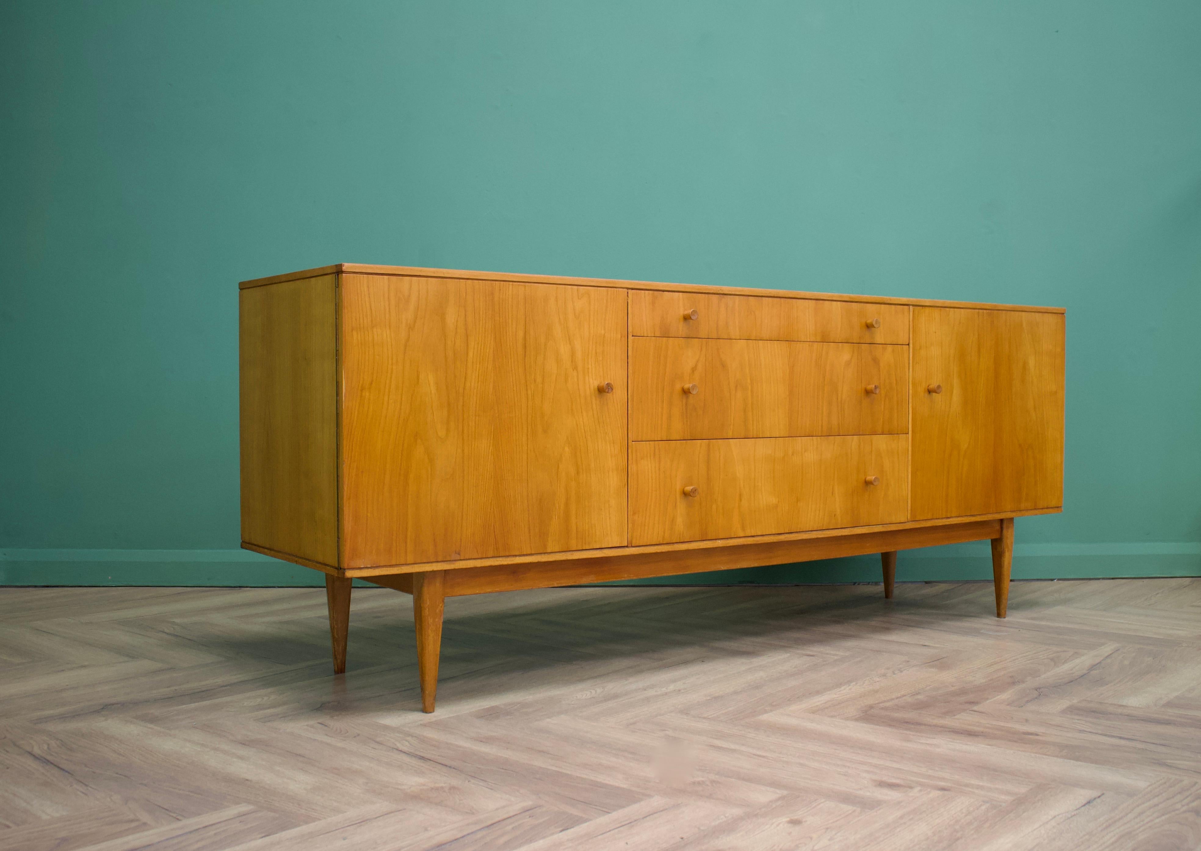 - Mid-Century Modern sideboard.
- Featuring three drawers and two cupboards
- Manufactured in the UK by Times Furnishings 
- Made from teak and teak veneer.
 