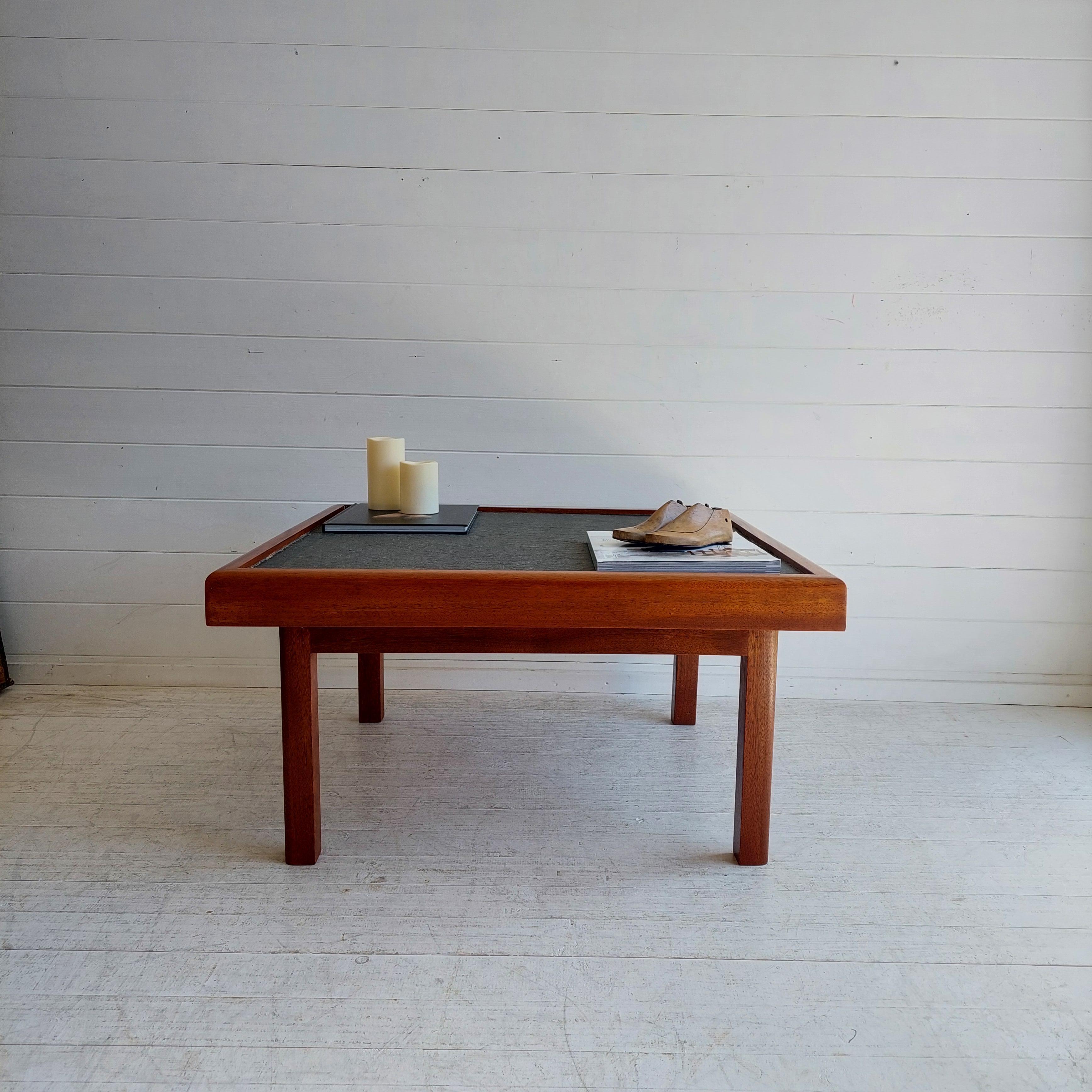 Mid Century Vintage Teak and slate coffee table, 1970

This handmade piece was designed under Pierre Chapo style for Maison Regain around 1970s. 
Also similar to Danish midcentury furniture manufacturers, Bramin. 

The structure of this coffee table