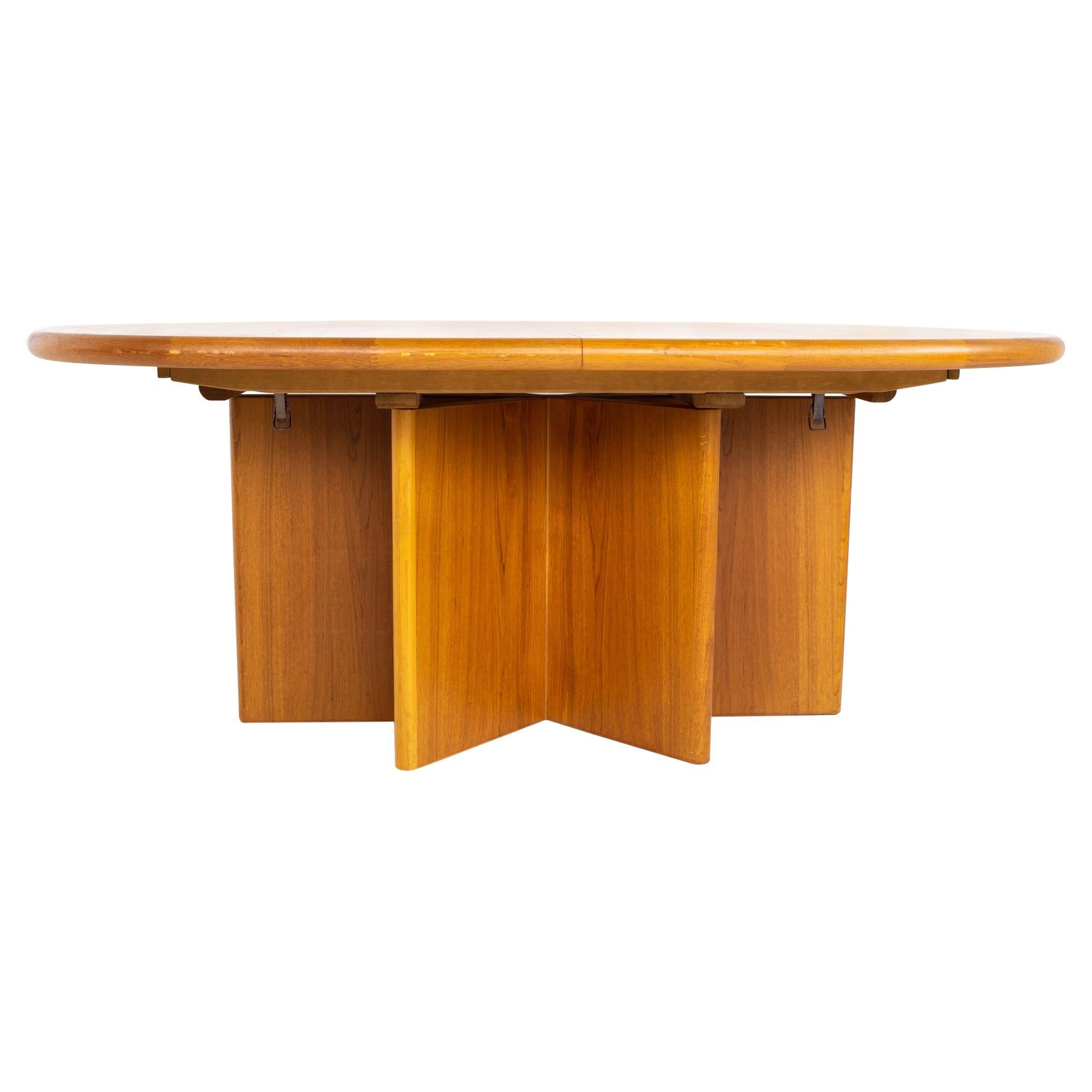 Mid century teak starburst pedestal expanding hidden leaf dining table
Table measures: 70 wide x 45 deep x 29 inches high, each leaf measures 19.5 inches wide, making a maximum table width of 109 inches wide when both leaves are used

All pieces