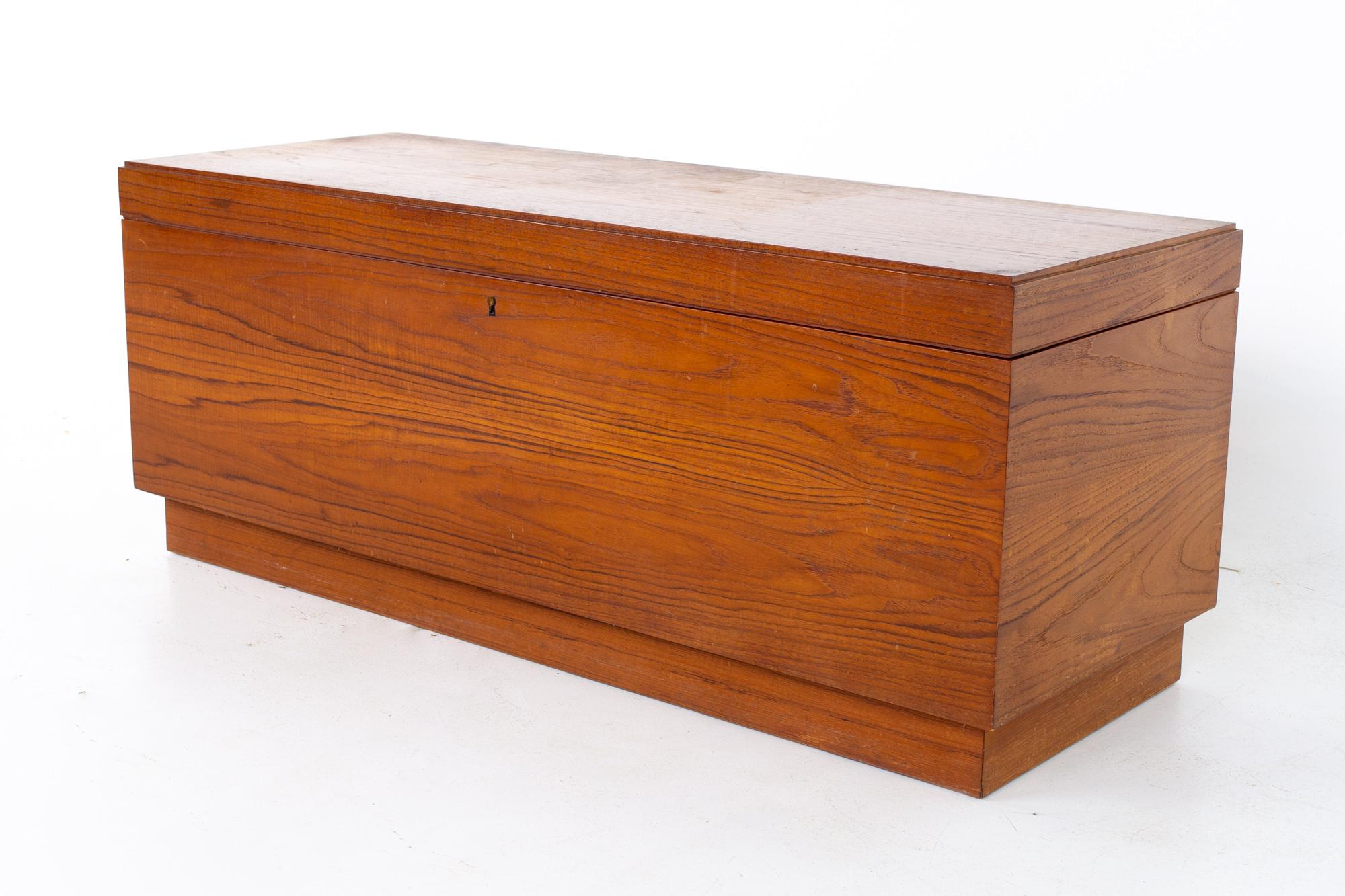 Mid century teak storage trunk bench
Bench measures: 47 wide x 17.75 deep x 19 inches high

All pieces of furniture can be had in what we call restored vintage condition. That means the piece is restored upon purchase so it’s free of watermarks,