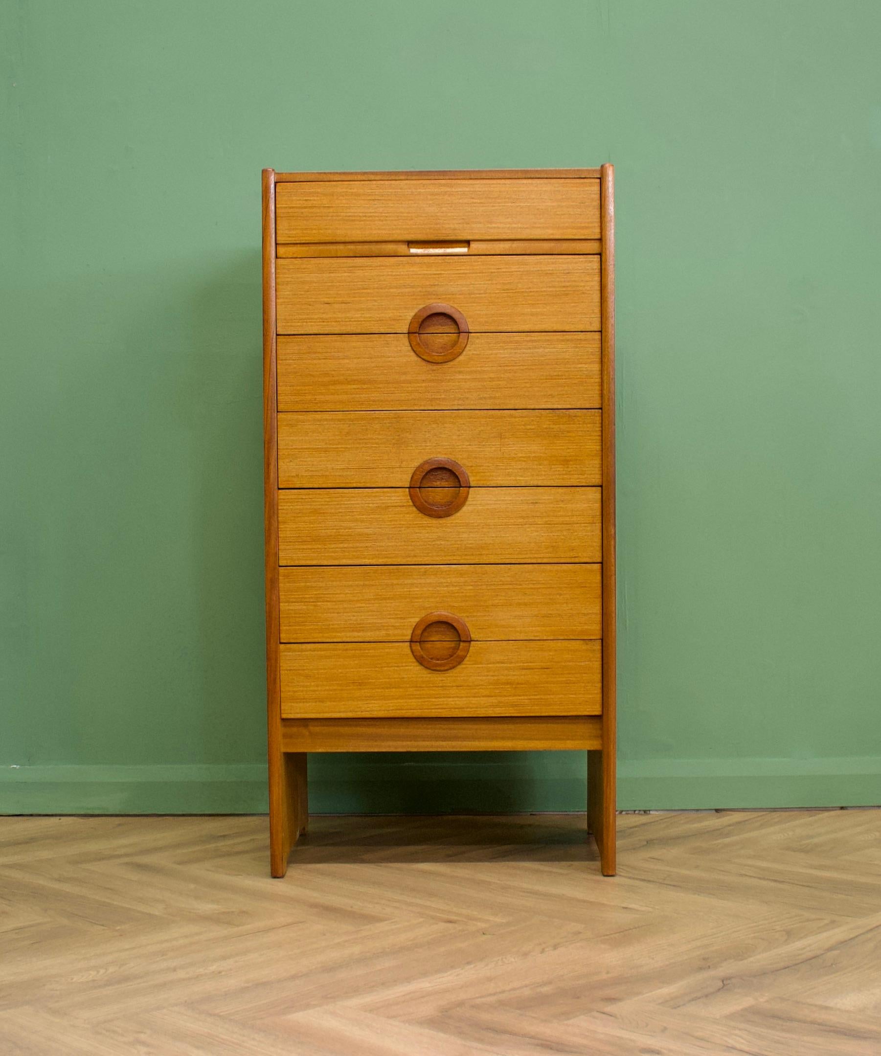 - midcentury chest of drawers
- Manufactured in the UK 
- Made from teak and teak veneer.
- Featuring 7 drawers.