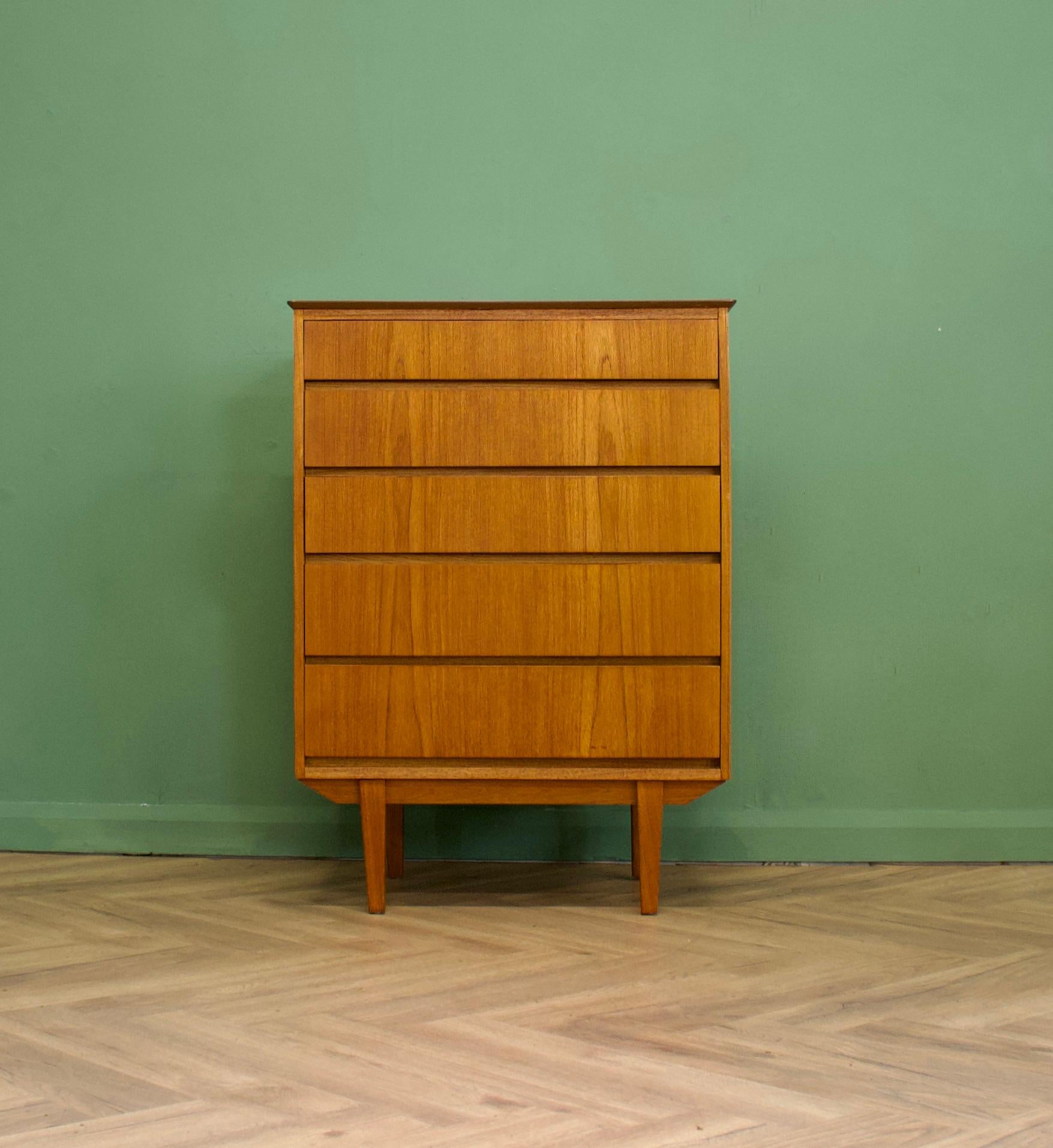 A mid century teak tallboy chest of drawers in the Danish style - circa 1960s
Standing on slightly tapered legs
The piece has a sleek modern look, with its handless drawers