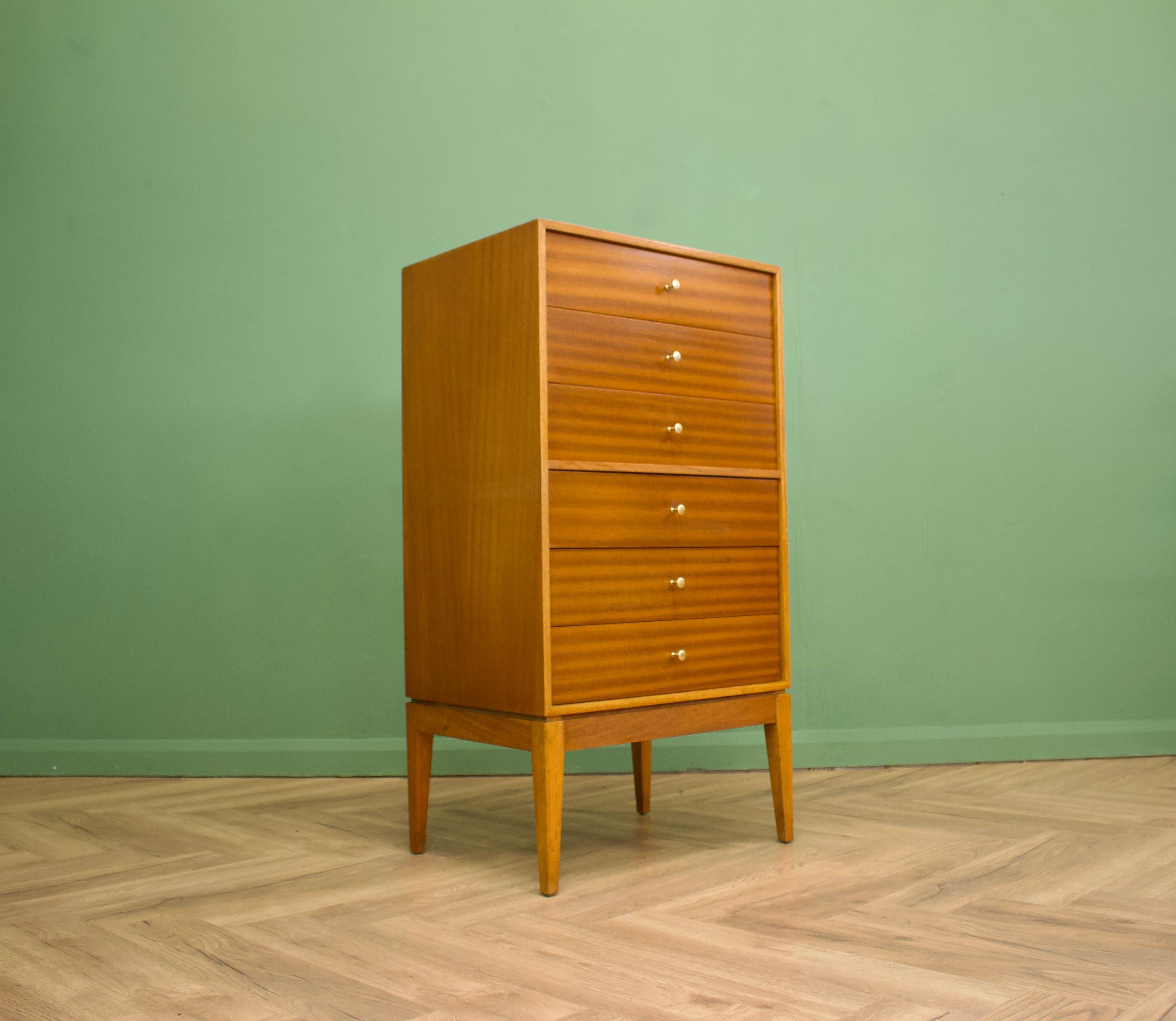 - Mid century chest of drawers
- Manufactured in the UK by Uniflex
- Designed by Peter Hayward
- Made from teak and teak veneer.