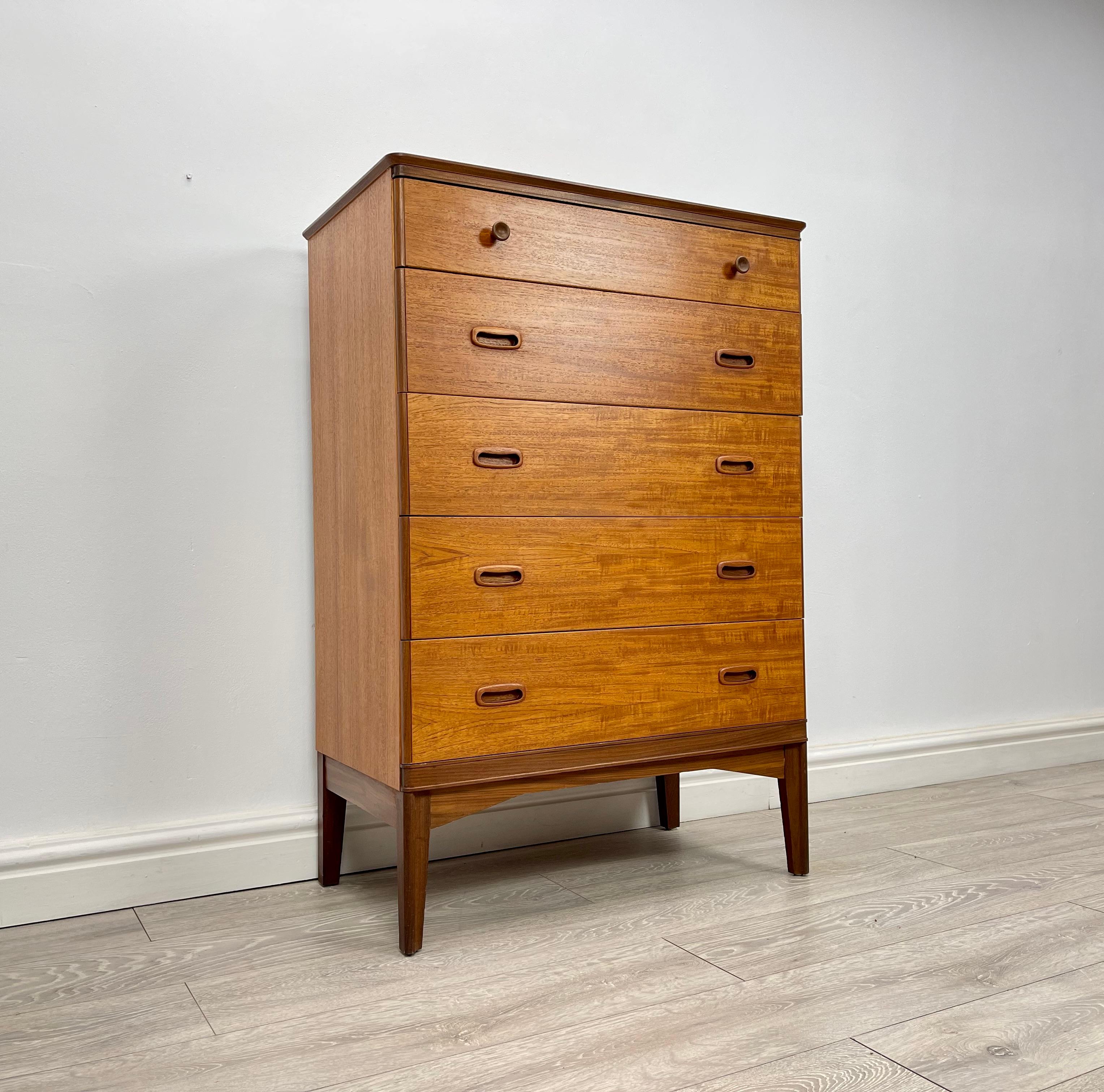 CHEST OF DRAWERS 
Midcentury teak tallboy chest of drawers made by Austinsuite circa 1960 .

The chest of drawers has stunning grain and golden patina throughout.

There’s five good size drawers fitted with solid teak inset handles , all drawers run