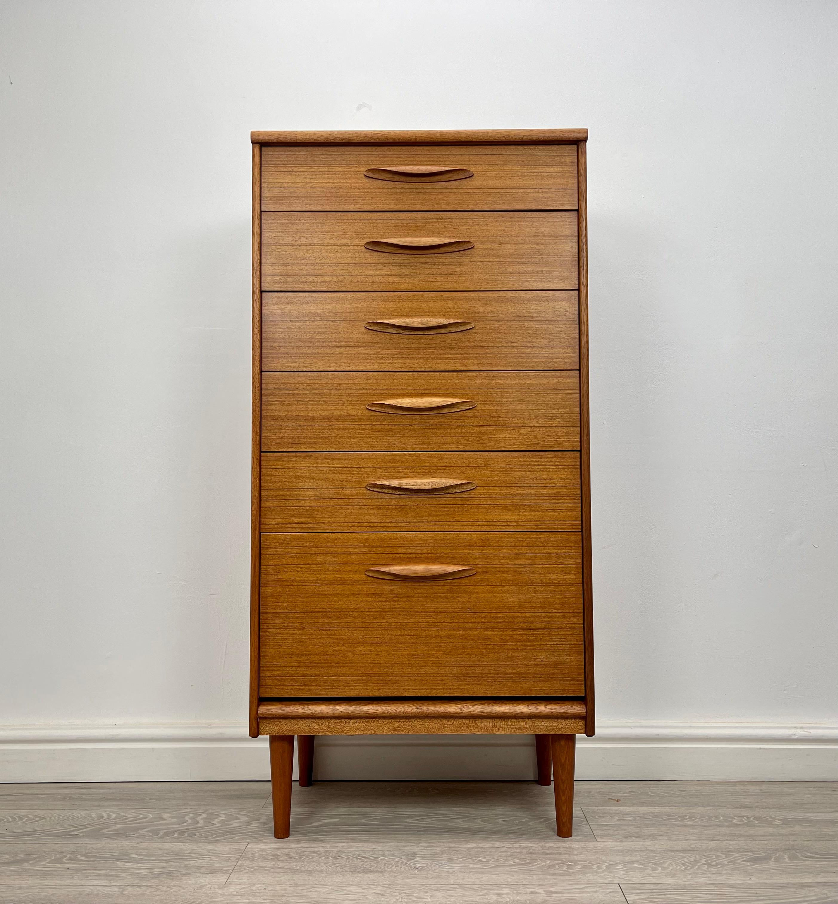 CHEST OF DRAWERS 
Midcentury teak tallboy chest of drawers made by Austinsuite circa 1960 .

The chest of drawers has stunning grain and golden patina throughout.

There’s six good size drawers fitted with solid teak handles , all drawers run