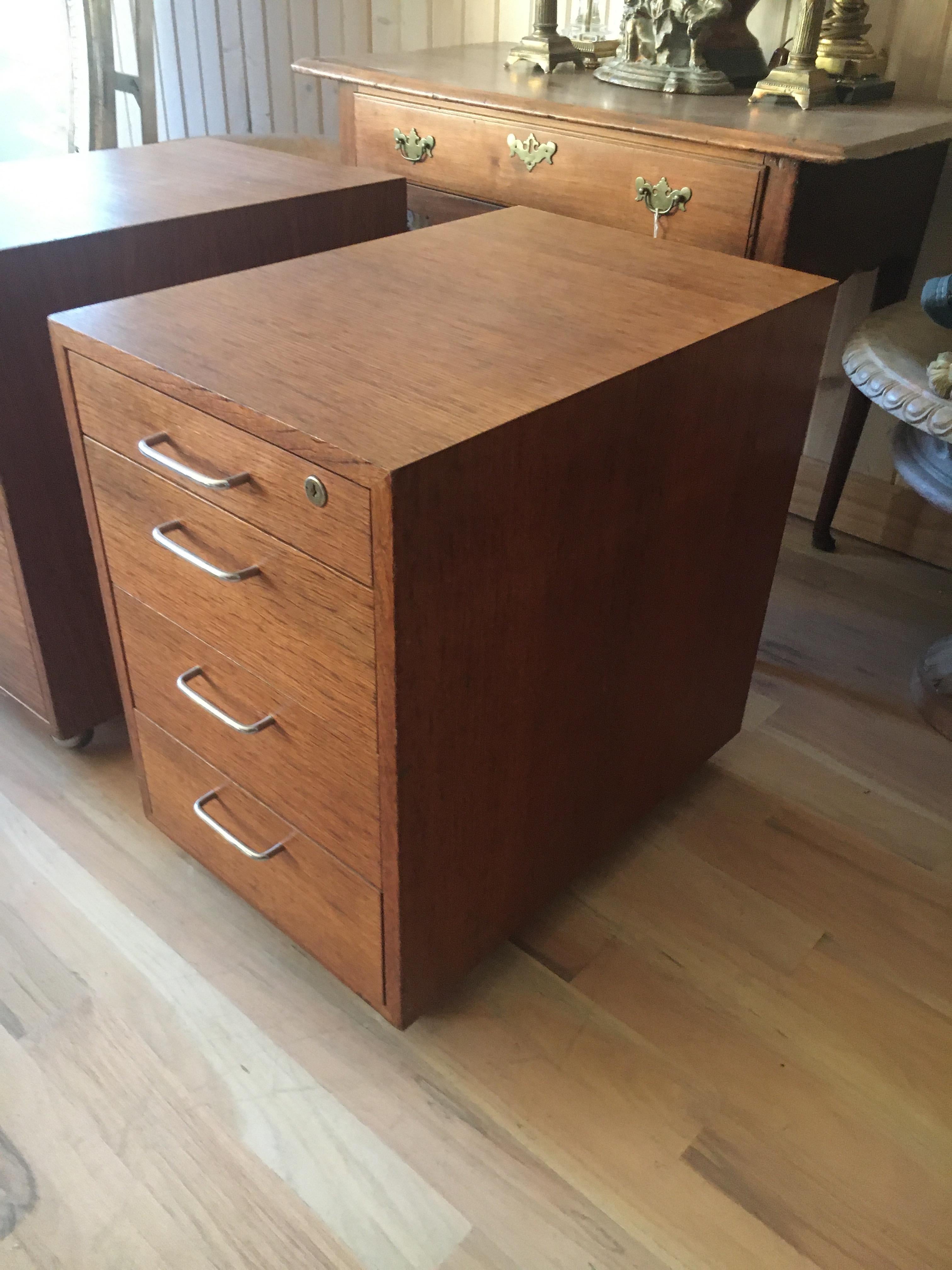 Midcentury teak three-drawer filing cabinets on casters, great bed side tables. We have detailed these so ready for installation. Priced per cabinet.