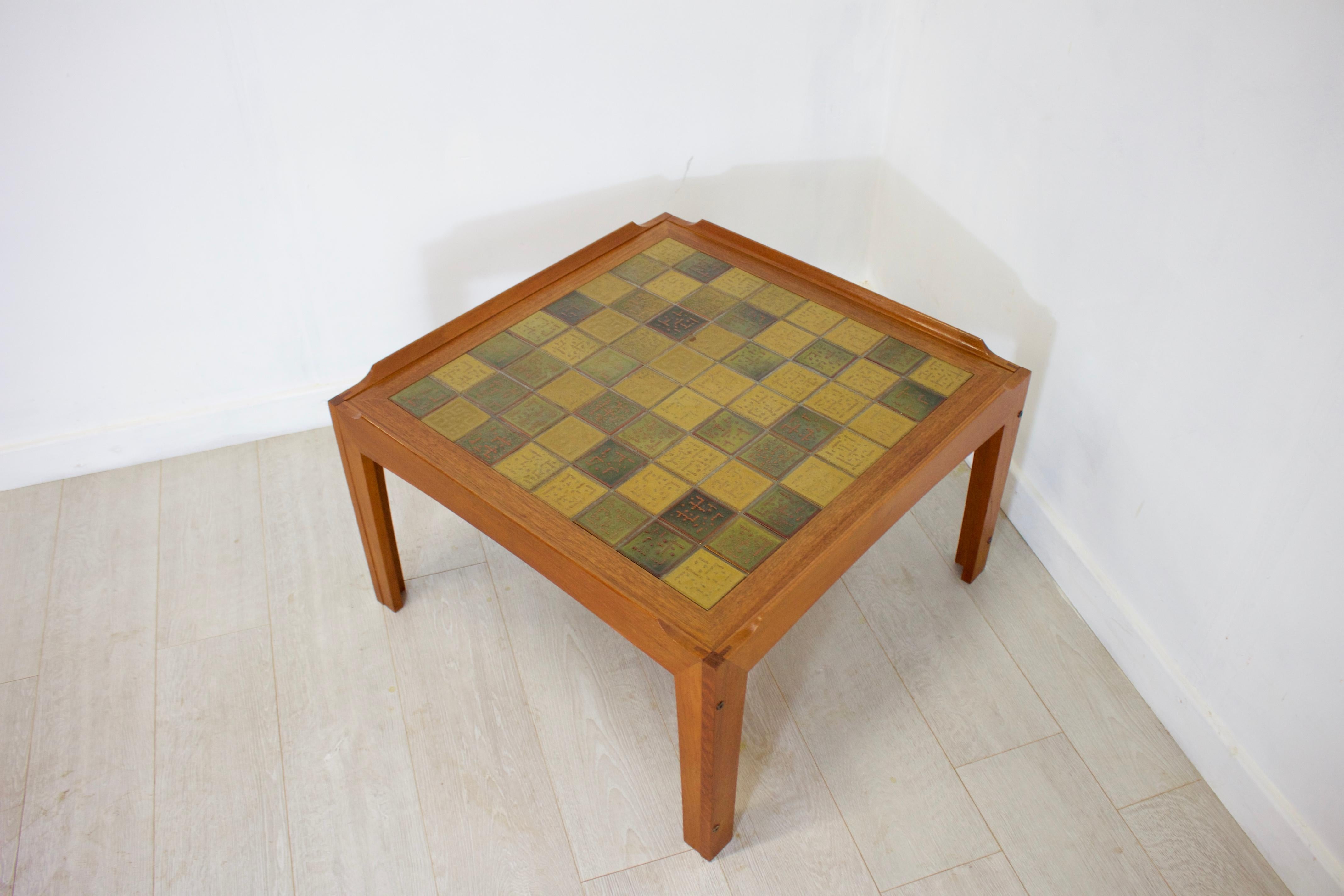 - Midcentury coffee table
- Made by Trioh in Denmark
- Made from teak and tiles.