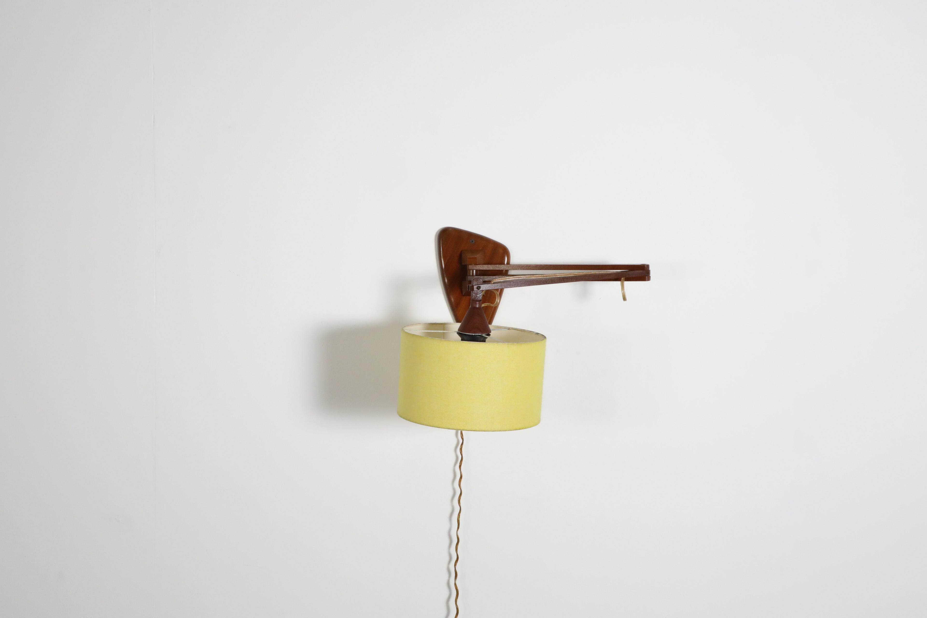 Mid-Century, Teak Wall Lamp with Articulating Arm and Yellow Shade For Sale 4