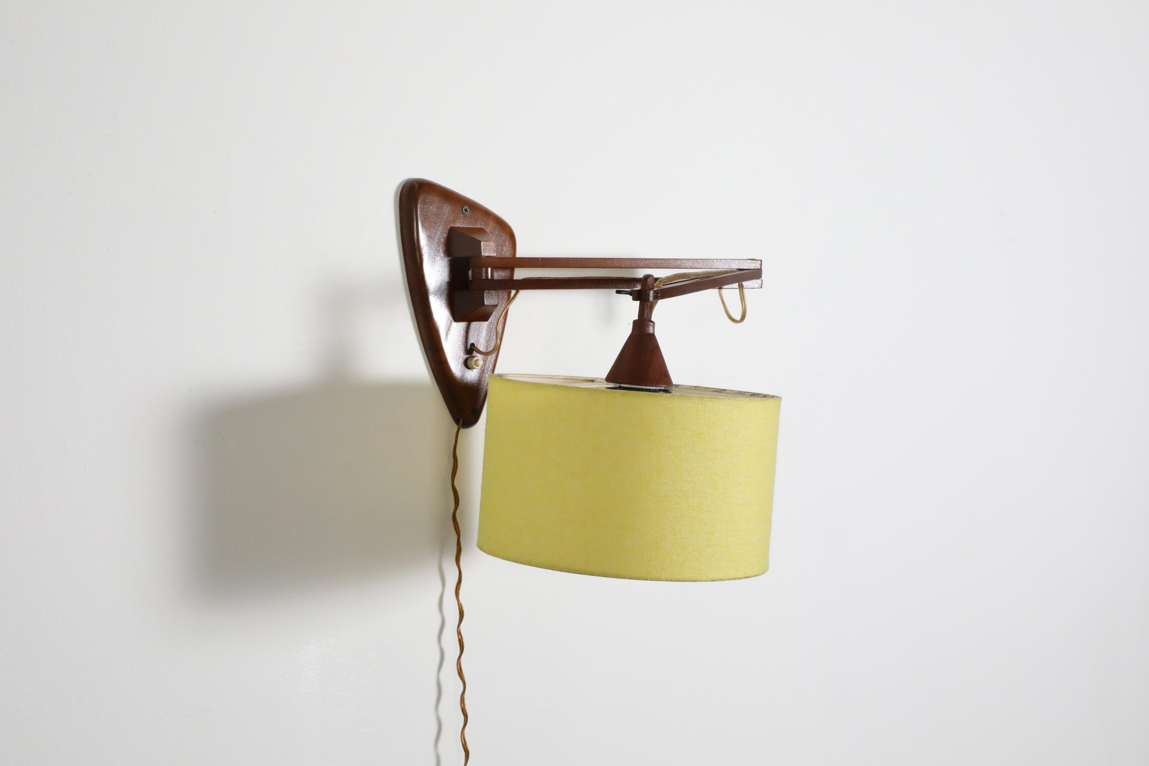 Mid-Century, Teak Wall Lamp with Articulating Arm and Yellow Shade For Sale 5