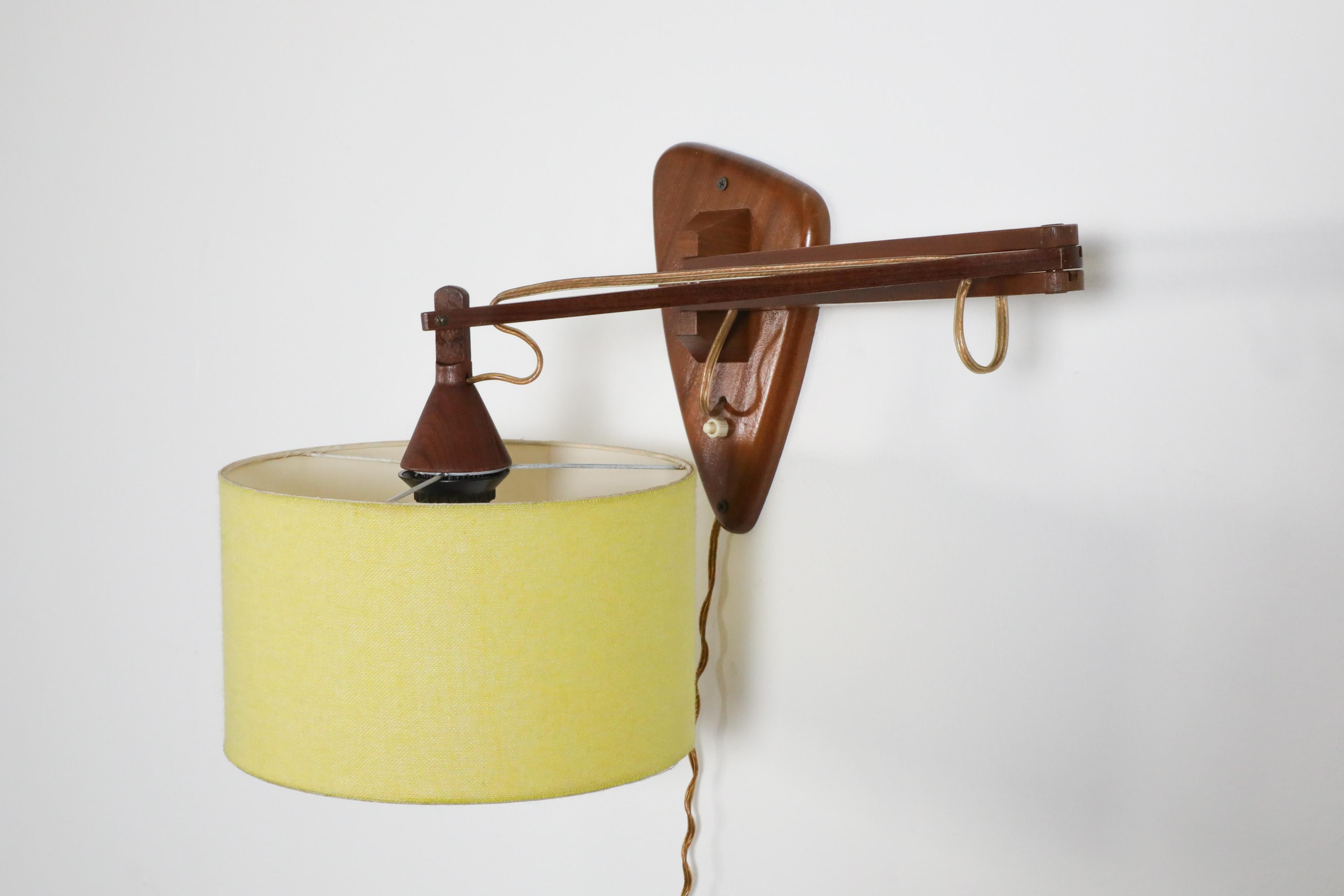 Mid-Century, Teak Wall Lamp with Articulating Arm and Yellow Shade For Sale 6