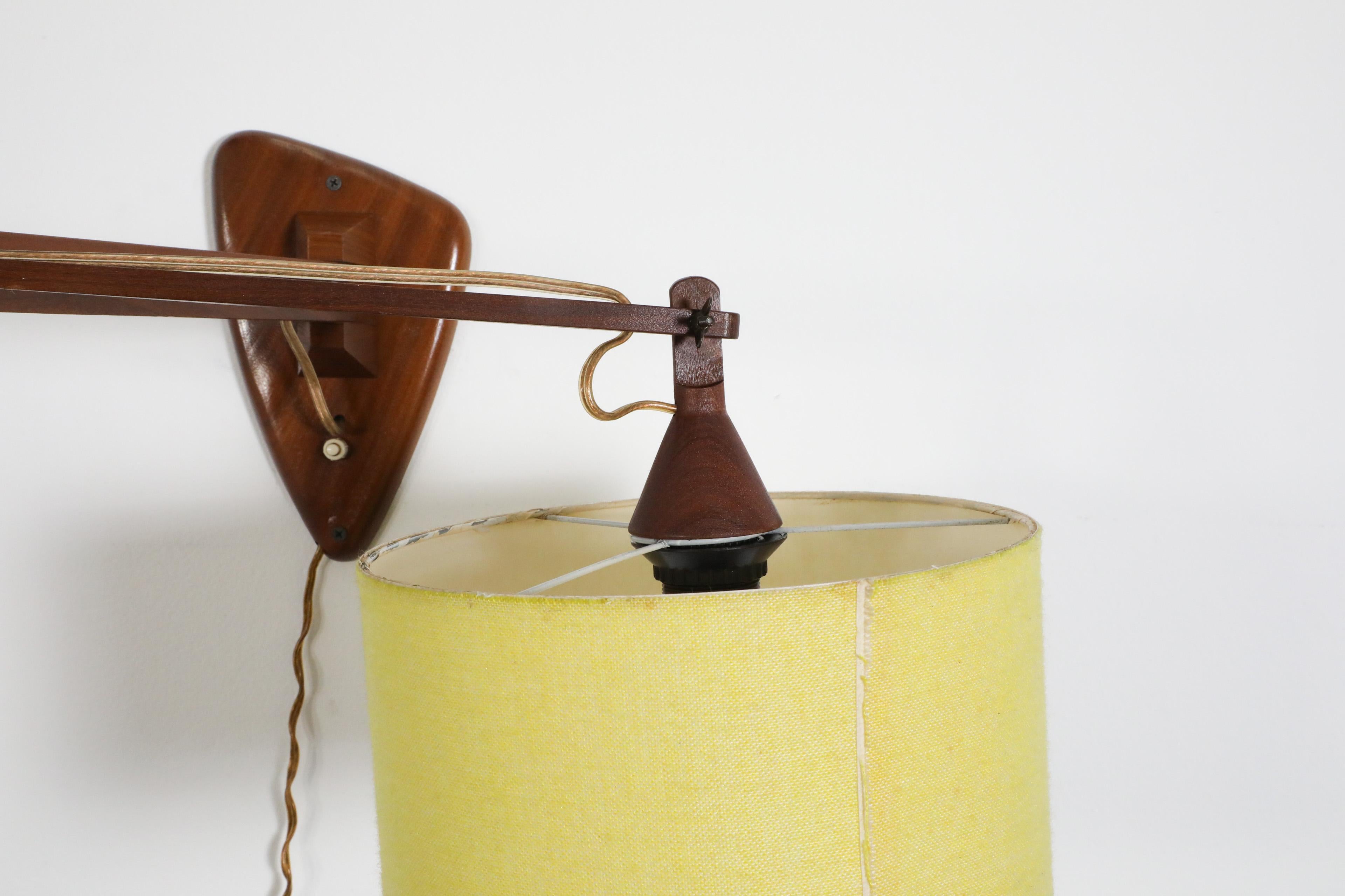 Mid-Century, Teak Wall Lamp with Articulating Arm and Yellow Shade For Sale 12
