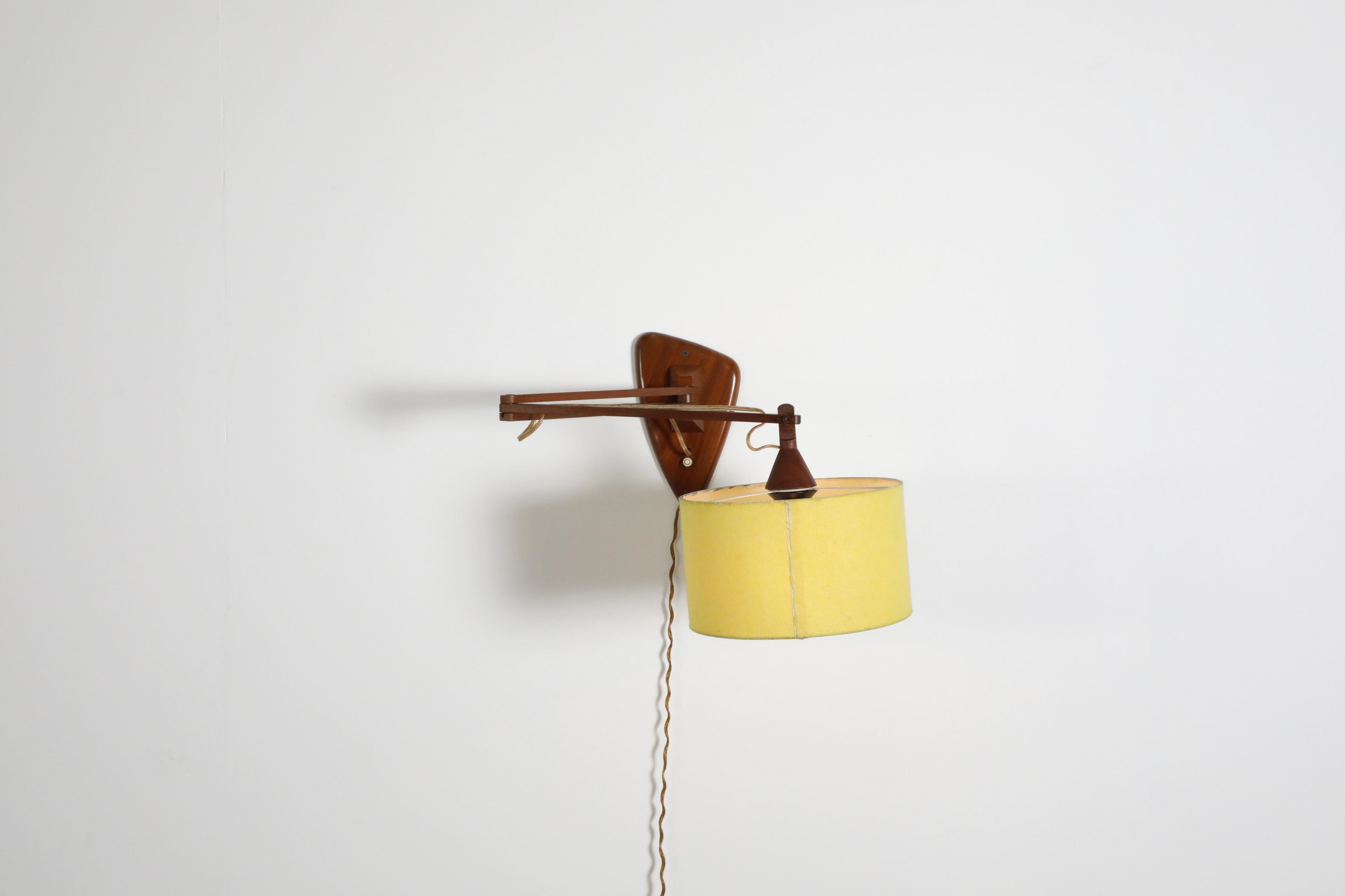 Mid-Century Modern Mid-Century, Teak Wall Lamp with Articulating Arm and Yellow Shade For Sale