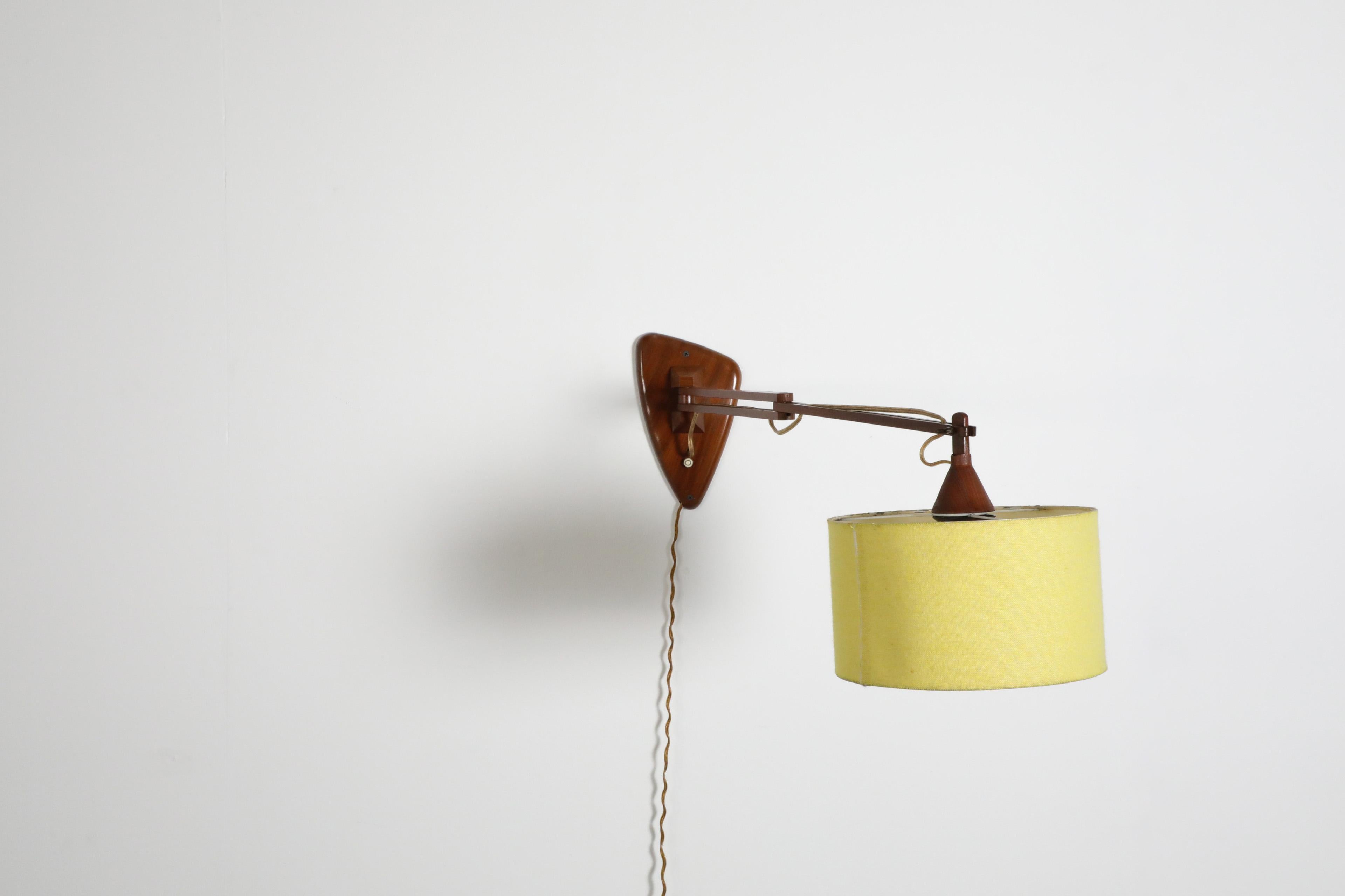 Linen Mid-Century, Teak Wall Lamp with Articulating Arm and Yellow Shade For Sale