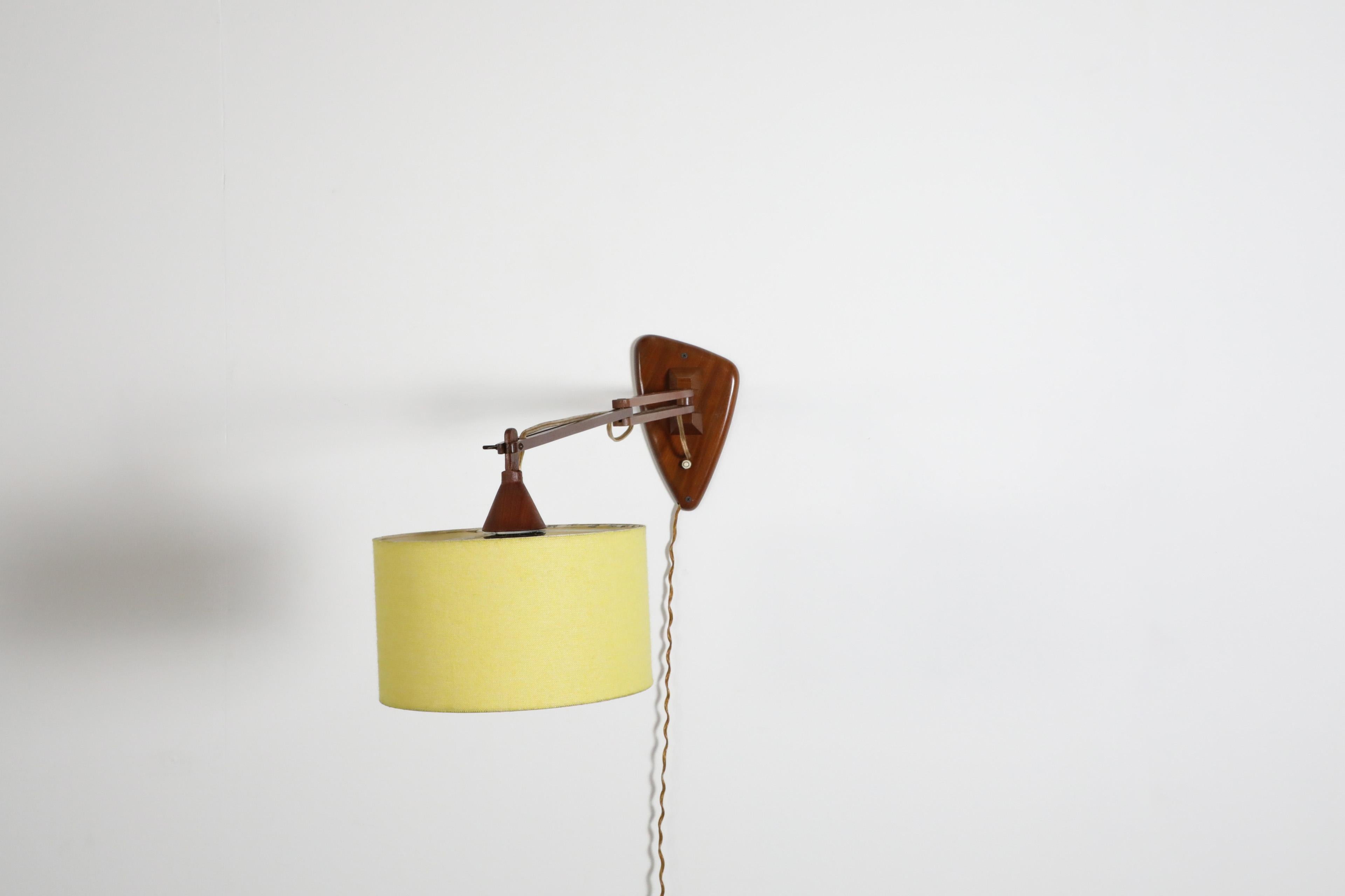 Mid-Century, Teak Wall Lamp with Articulating Arm and Yellow Shade For Sale 2