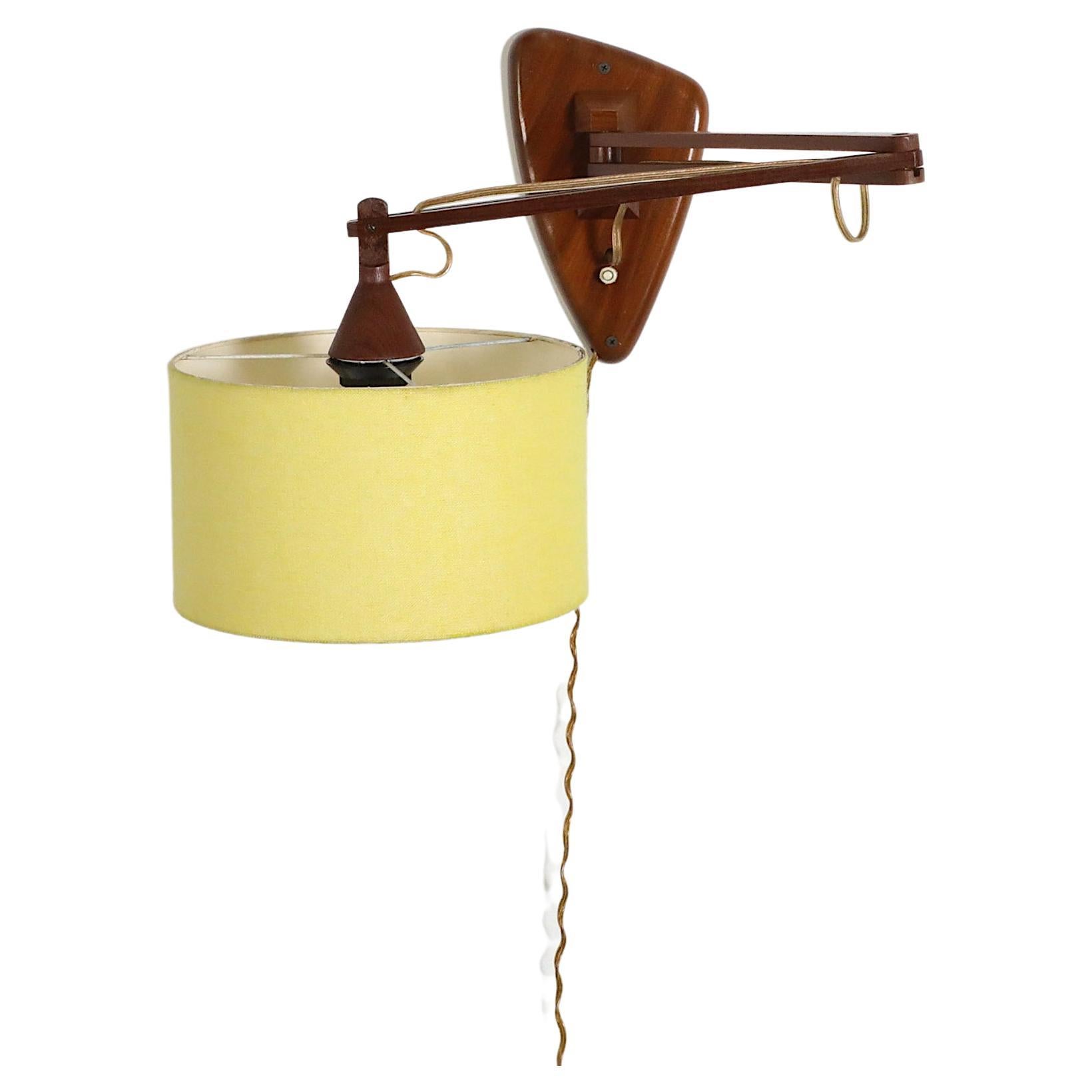 Mid-Century, Teak Wall Lamp with Articulating Arm and Yellow Shade For Sale