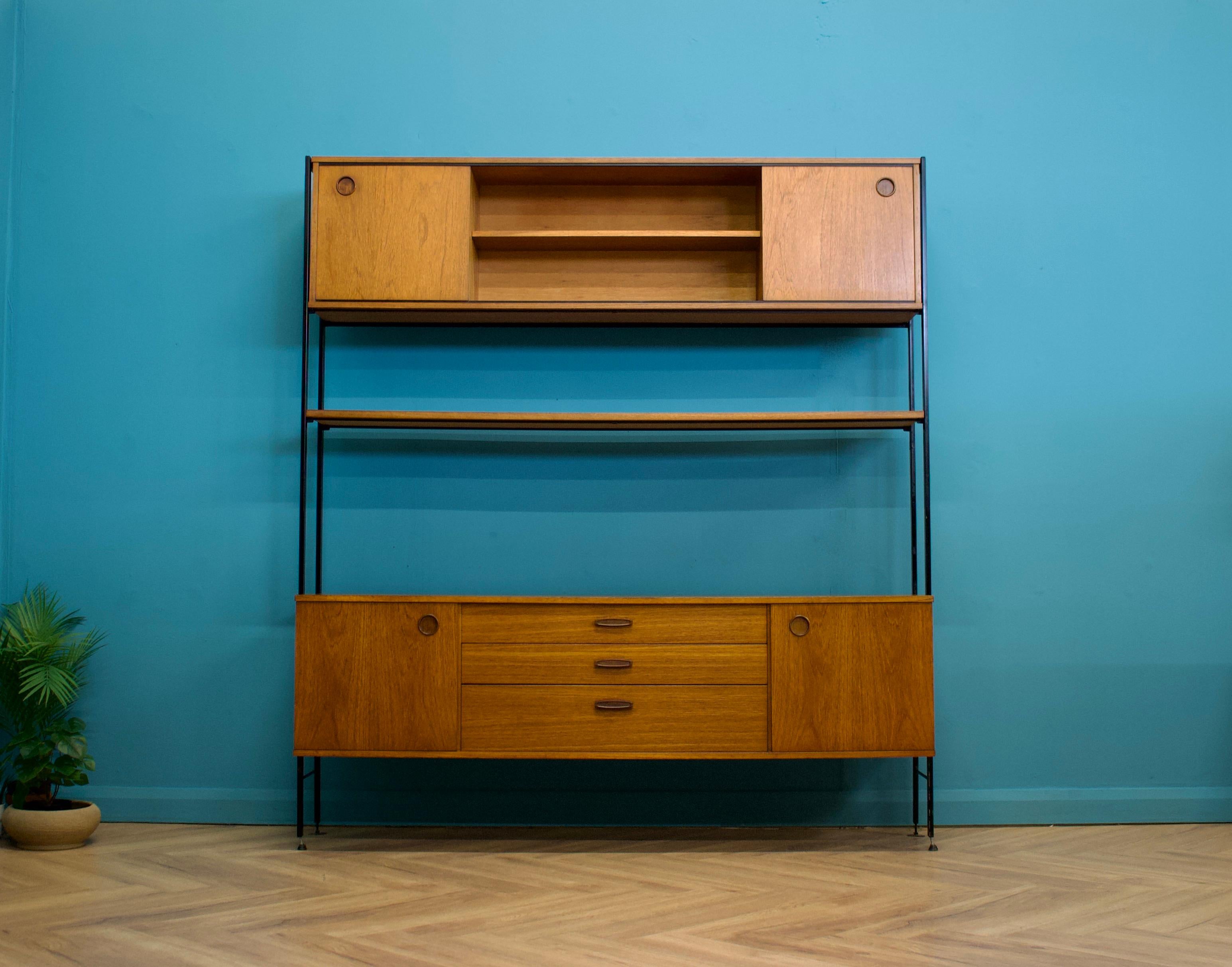 Mid-century modern teak shelving unit from Avalon - circa 1960s

Featuring two sliding door units and a shelf - this piece is modular, the individual pieces can be moved to any height or position




Full assembly instructions will be provided
