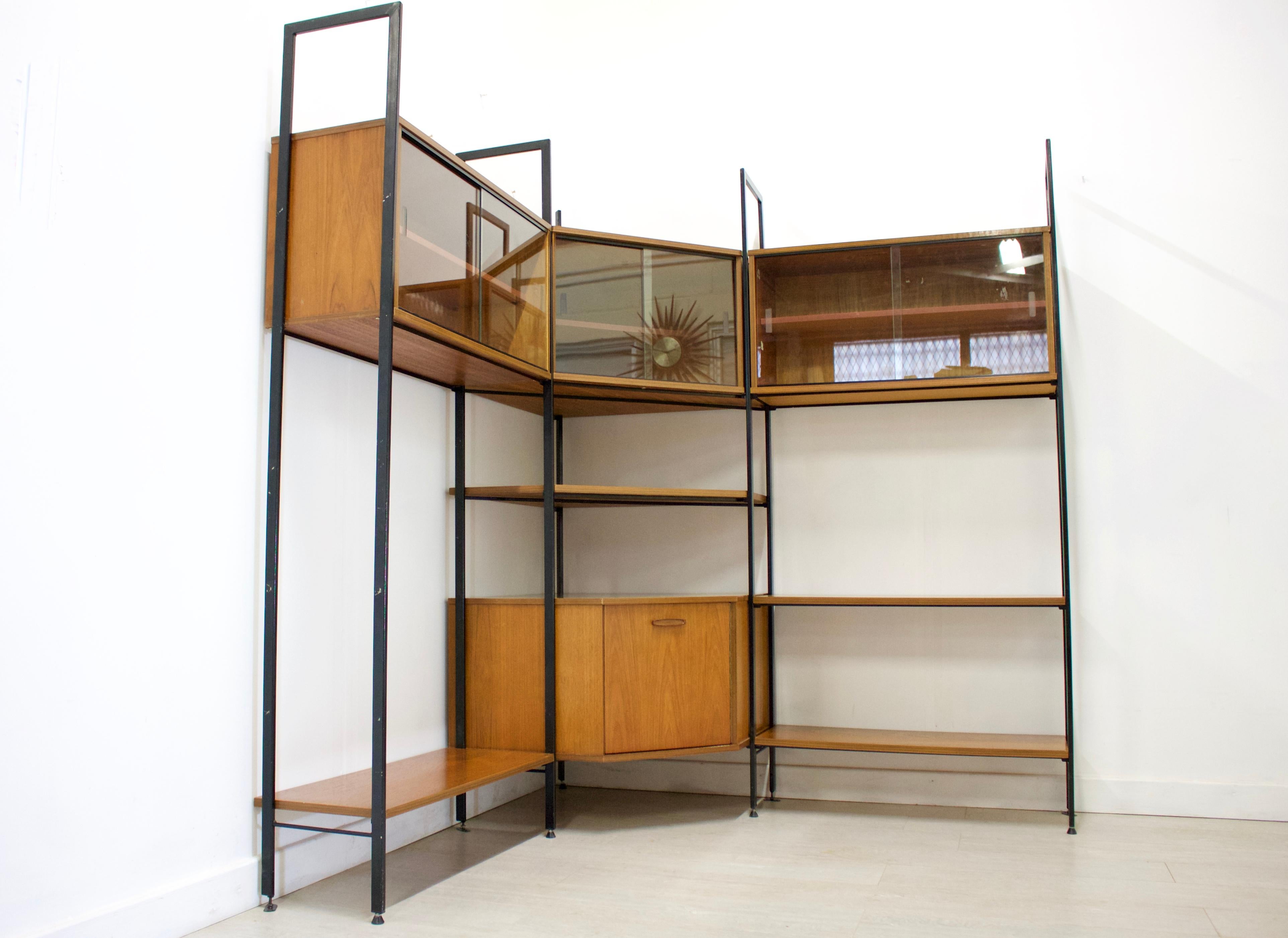 Midcentury design

- Mid-Century Modern shelving unit or wall unit
- Manufactured by Avalon in the UK
- Made from teak and teak veneer
- The individual units and shelves can have multiple configuration options
- Featuring glass sliding doors