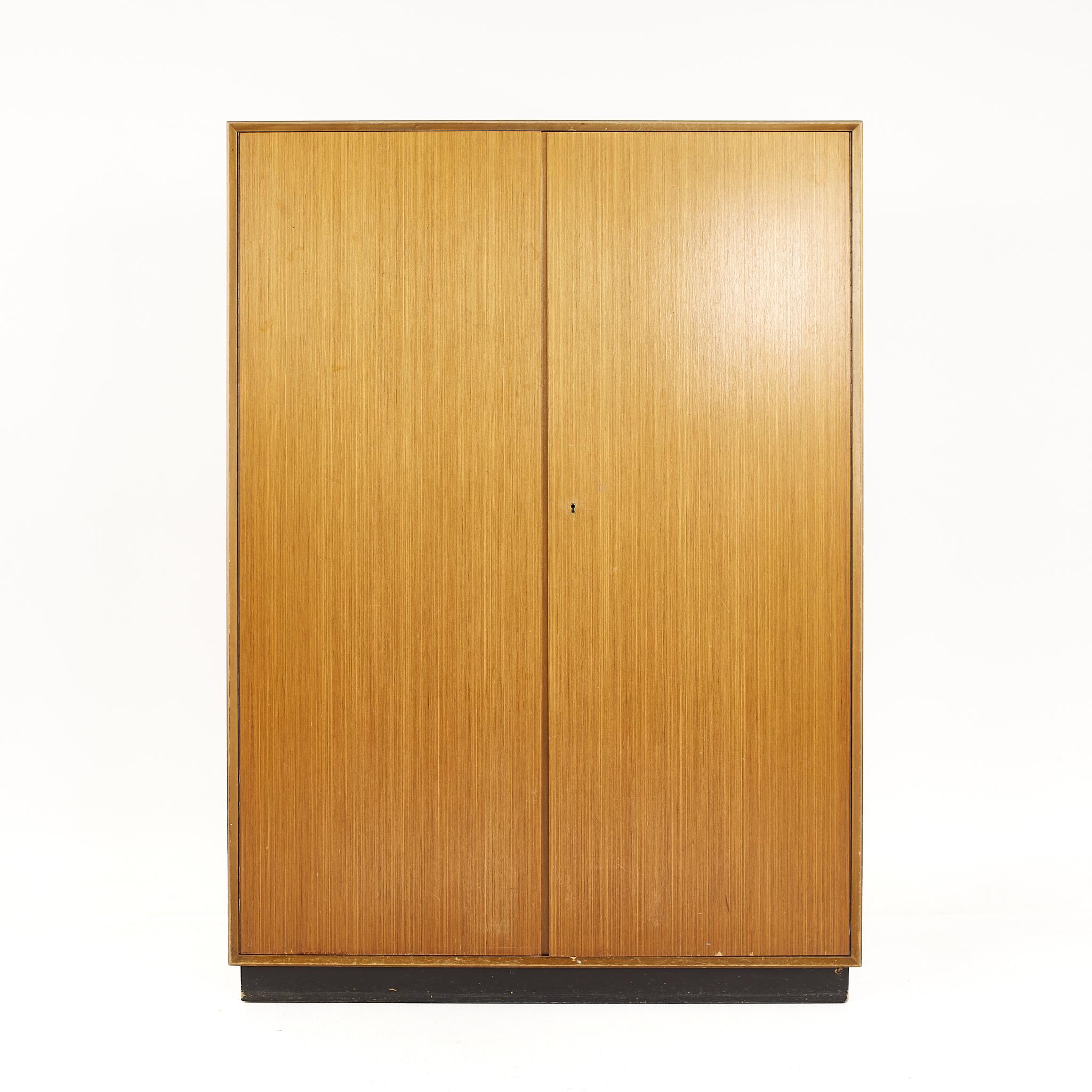 Mid century teak wardrobe armoire

The armoire measures: 45 wide x 21.5 deep x 62.75 inches high

All pieces of furniture can be had in what we call restored vintage condition. That means the piece is restored upon purchase so it’s free of