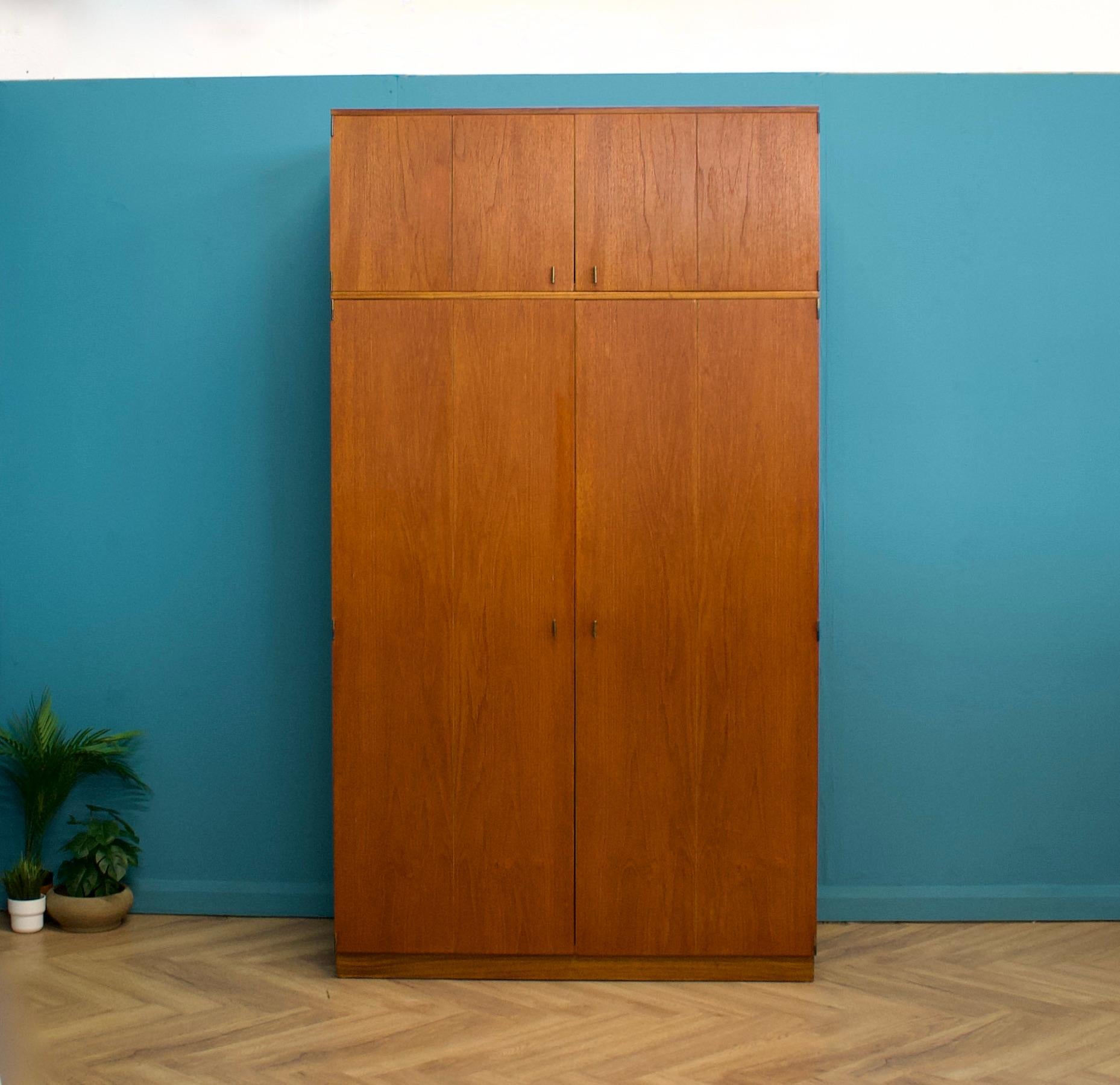A freestanding triple door taller than usual teak wardrobe from G Plan from the Quadrille range - circa 1960s


A freestanding double door taller than usual teak wardrobe from Beithcraft - circa 1960s


Fitted out with a clothes rail
A full length