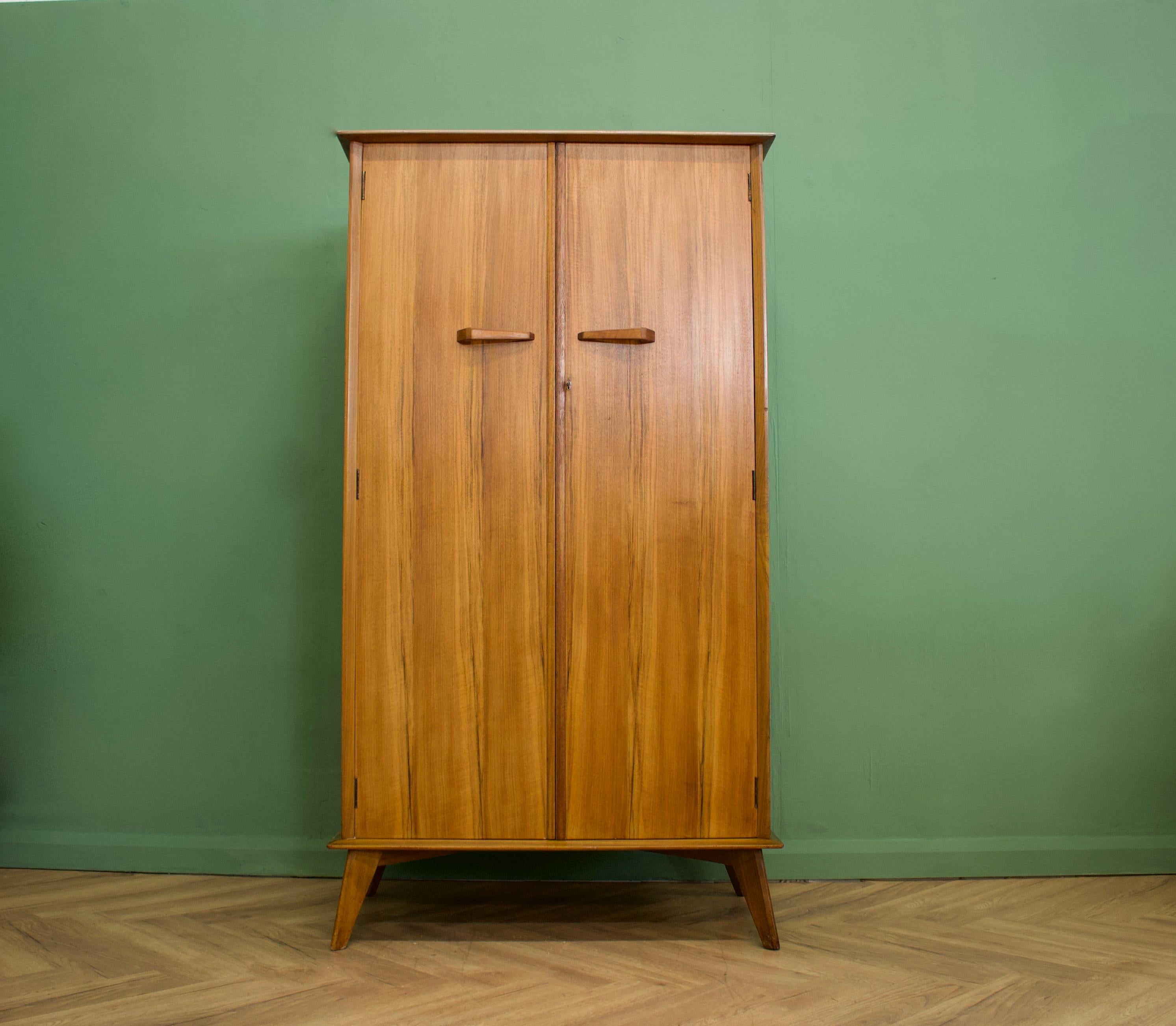 A freestanding teak wardrobe from Crown Furniture.
Featuring a hanging rail the full width.