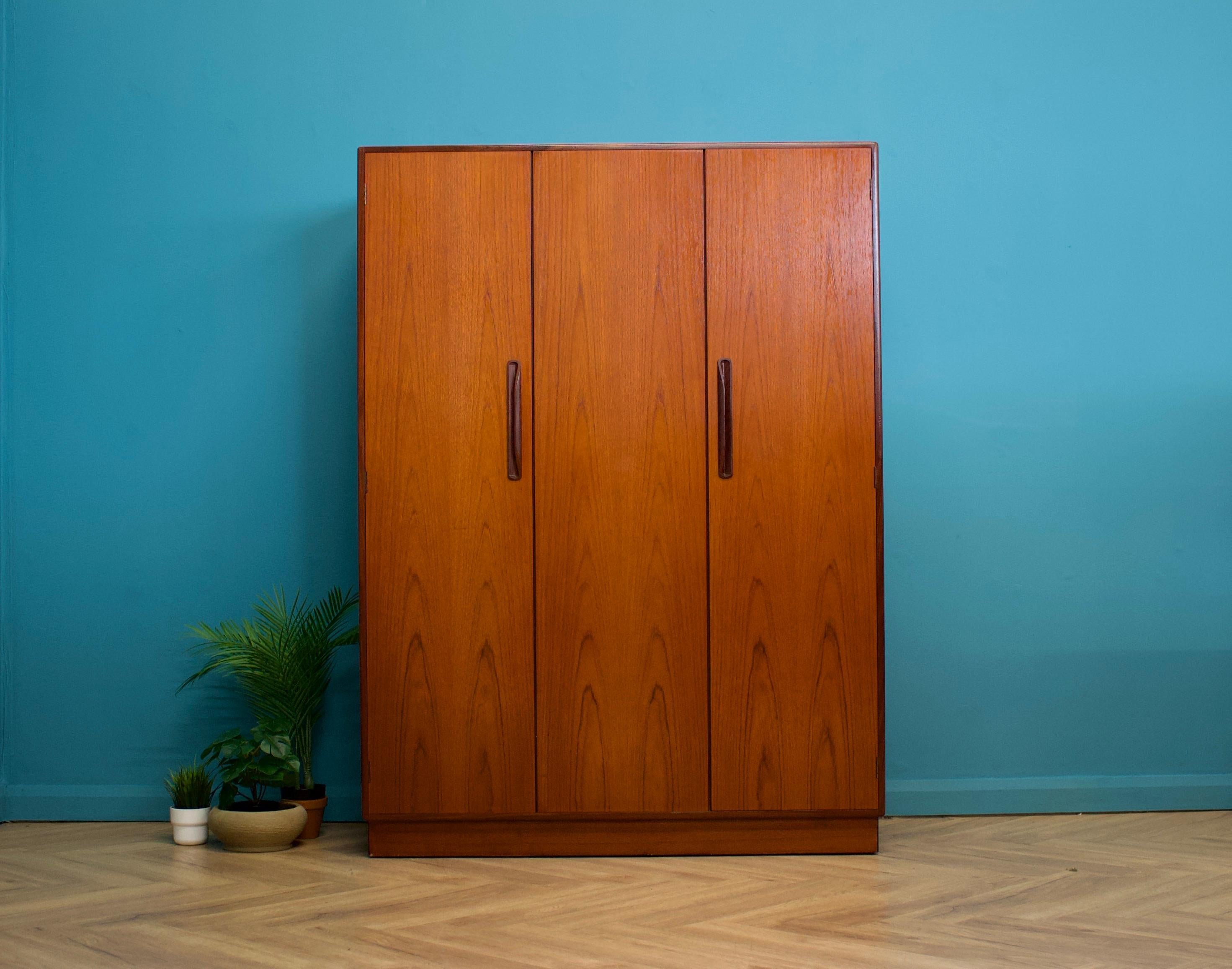 A freestanding triple door teak wardrobe from G Plan from the Fresco range - circa 1970s


Fitted out with a clothes rail the full width
The style of this wardrobe is minimalist - with it's clean lines 
