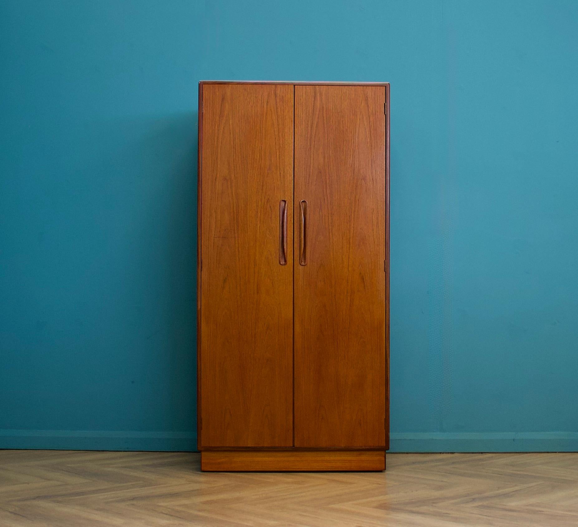 A freestanding double door teak wardrobe from G Plan from the Fresco range - circa 1970s


Fitted out with a clothes rail the full width.
The style of this wardrobe is minimalist - with it's clean lines


This wardrobe can be flat packed