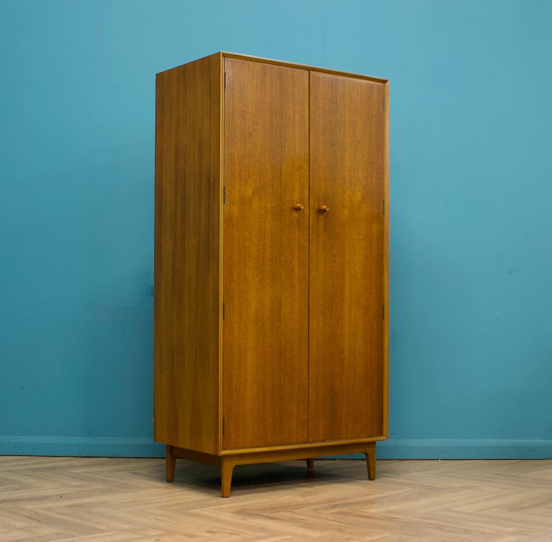 - Mid-Century Modern wardrobe
- Manufactured by Vesper in the UK
- Made from Teak 
Teak Veneer
- Featuring a hanging rail and shelves.