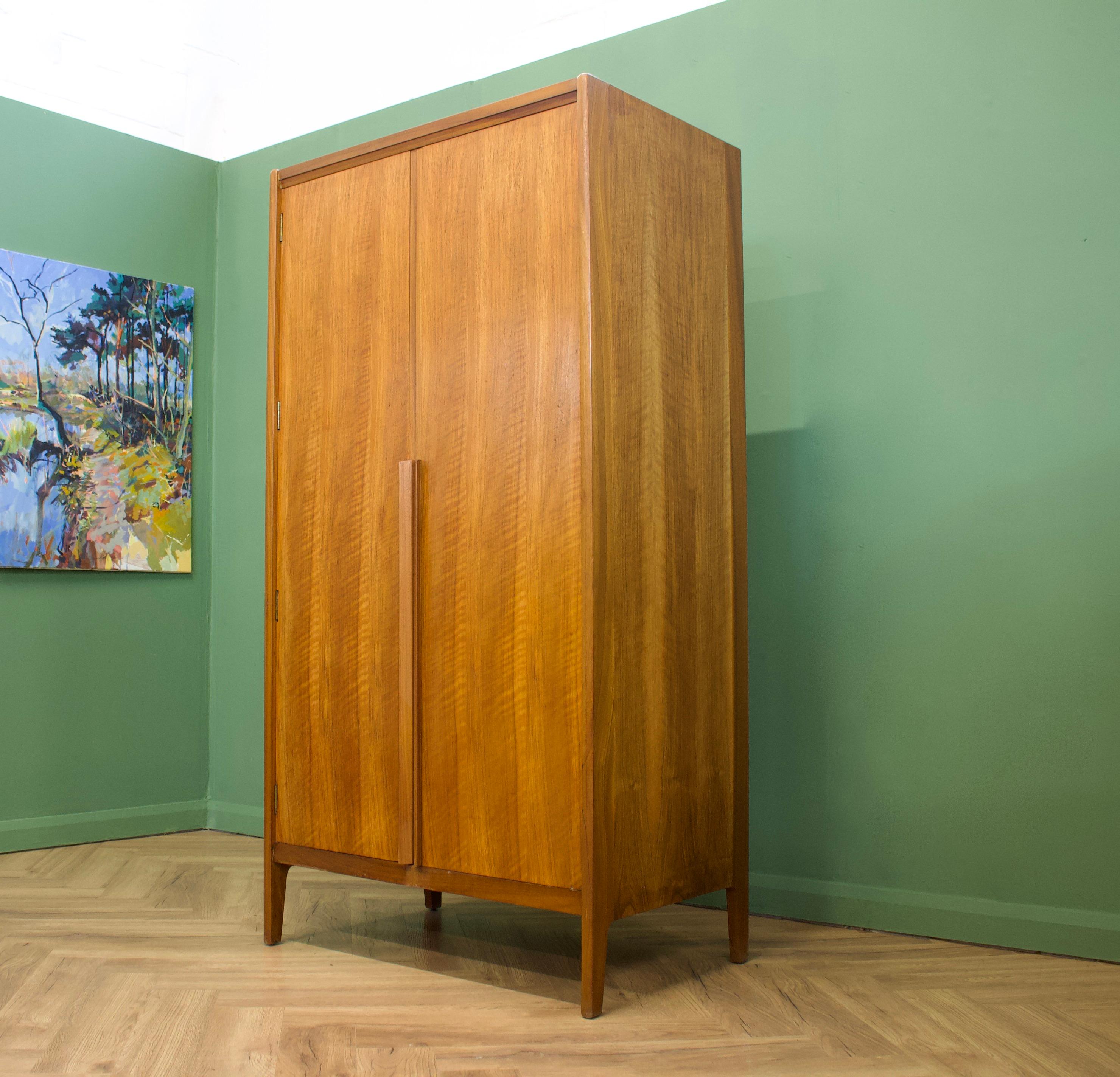 Mid-Century Modern wardrobe
Manufactured by Younger in the UK 
Made from Teak & Teak Veneer
Featuring a hanging rail and a shelves.