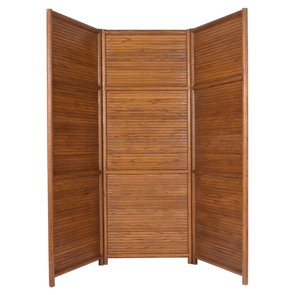 This Mid-Century Modern three-panel room divider has been restored, is made out of Teak wood with its original walnut color stain and patina finish. The divider dates back to the 1960s, stands at over six feet tall, and full extended covers 7 1/2