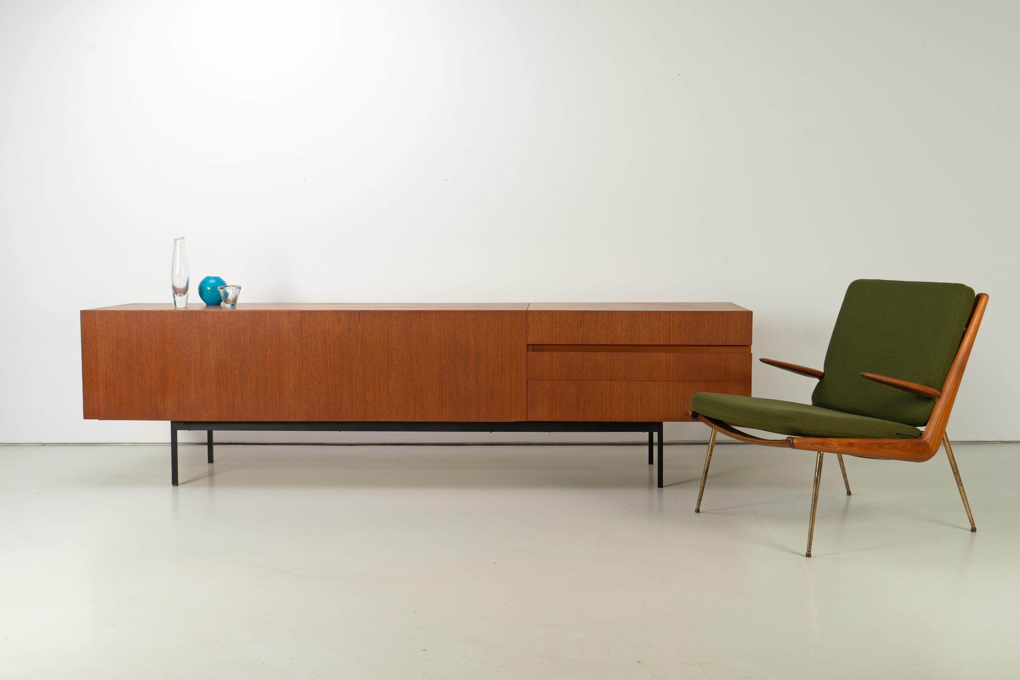Rare sideboard by German mid-century designer Dieter Waeckerlin, produced by Behr. This sideboard is executed in teak wood with a black steel base with manufacturer's stamp.