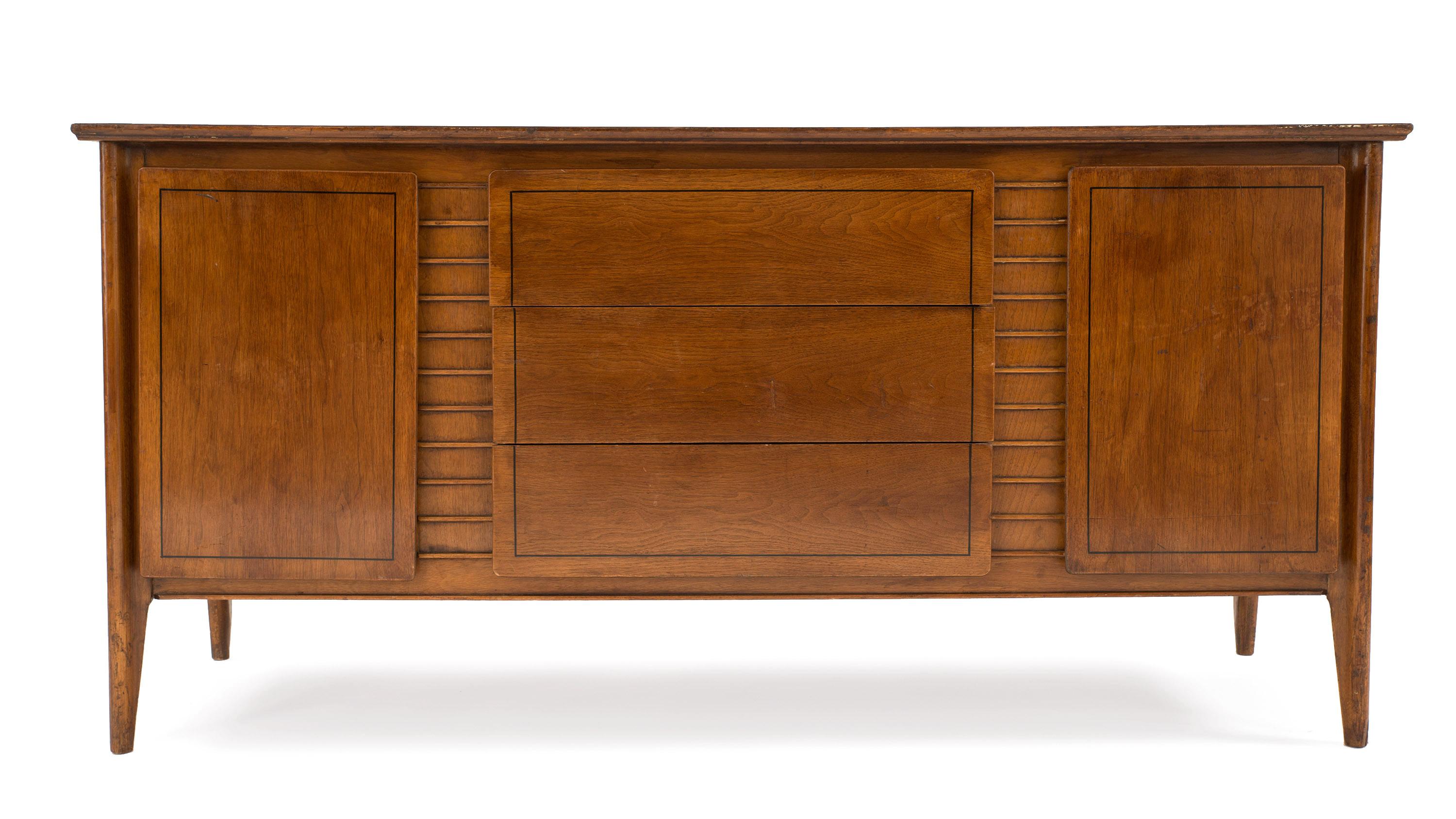 Mid-Century Modern Scandinavian teak wood sideboard with 2 side doors centering three front drawers having a horizontal ribbed veneer
