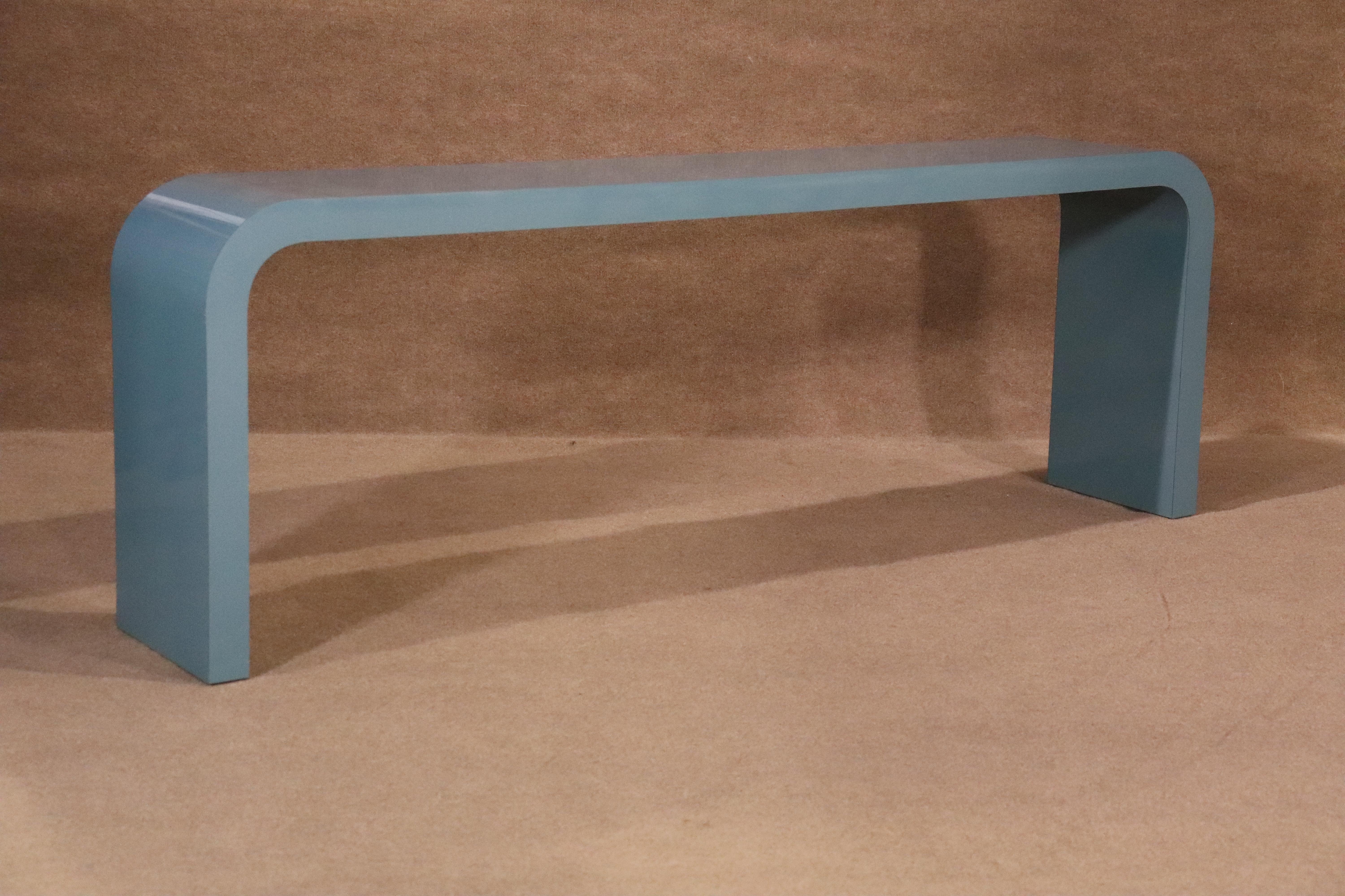Long mid-century modern simple console table with a flowing line down to the legs. Great for an entry way or behind a sofa.
Please confirm location NY or NJ