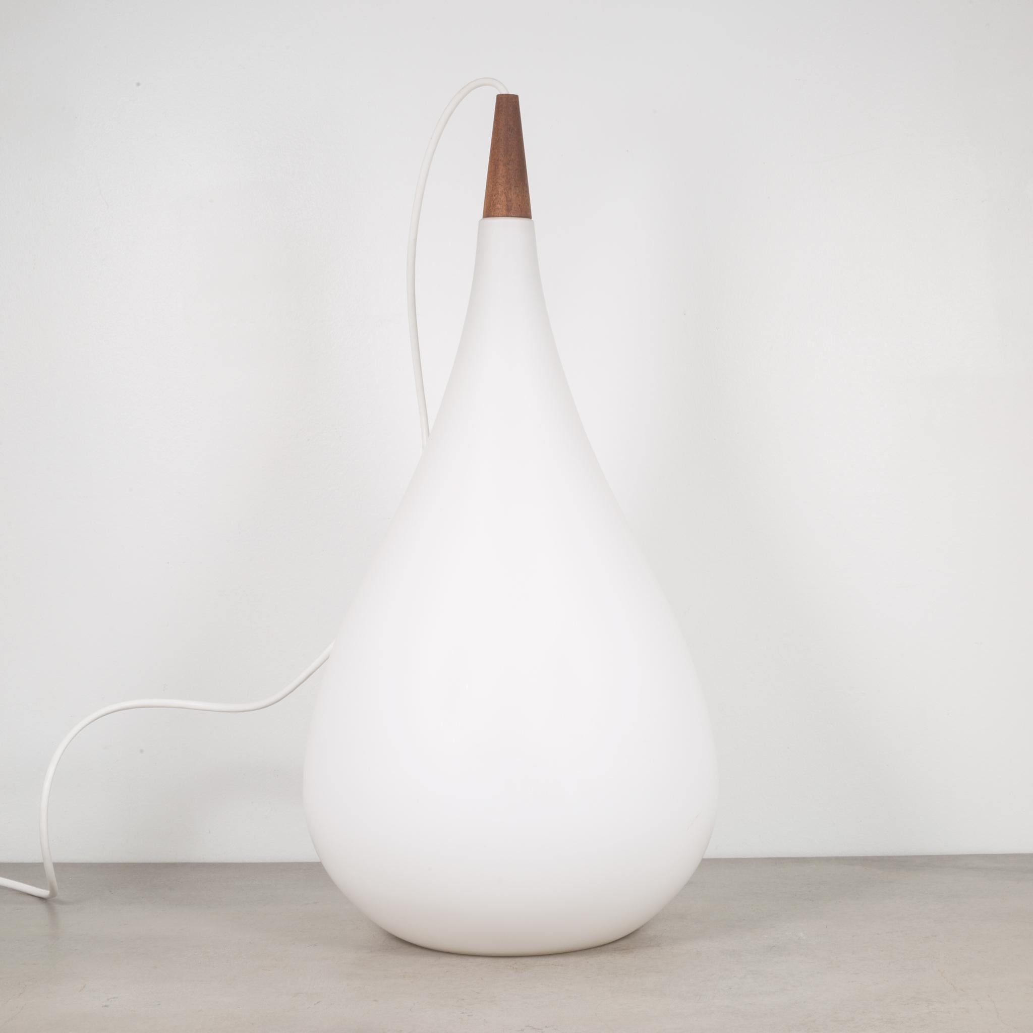 About

This is an original milk glass and teak tear drop pendant by Holmgaard. This piece has retained its original finish. The cord has been replaced.

Creator Holmgaard, Denmark.
Date of manufacture circa 1960s.
Materials and techniques milk