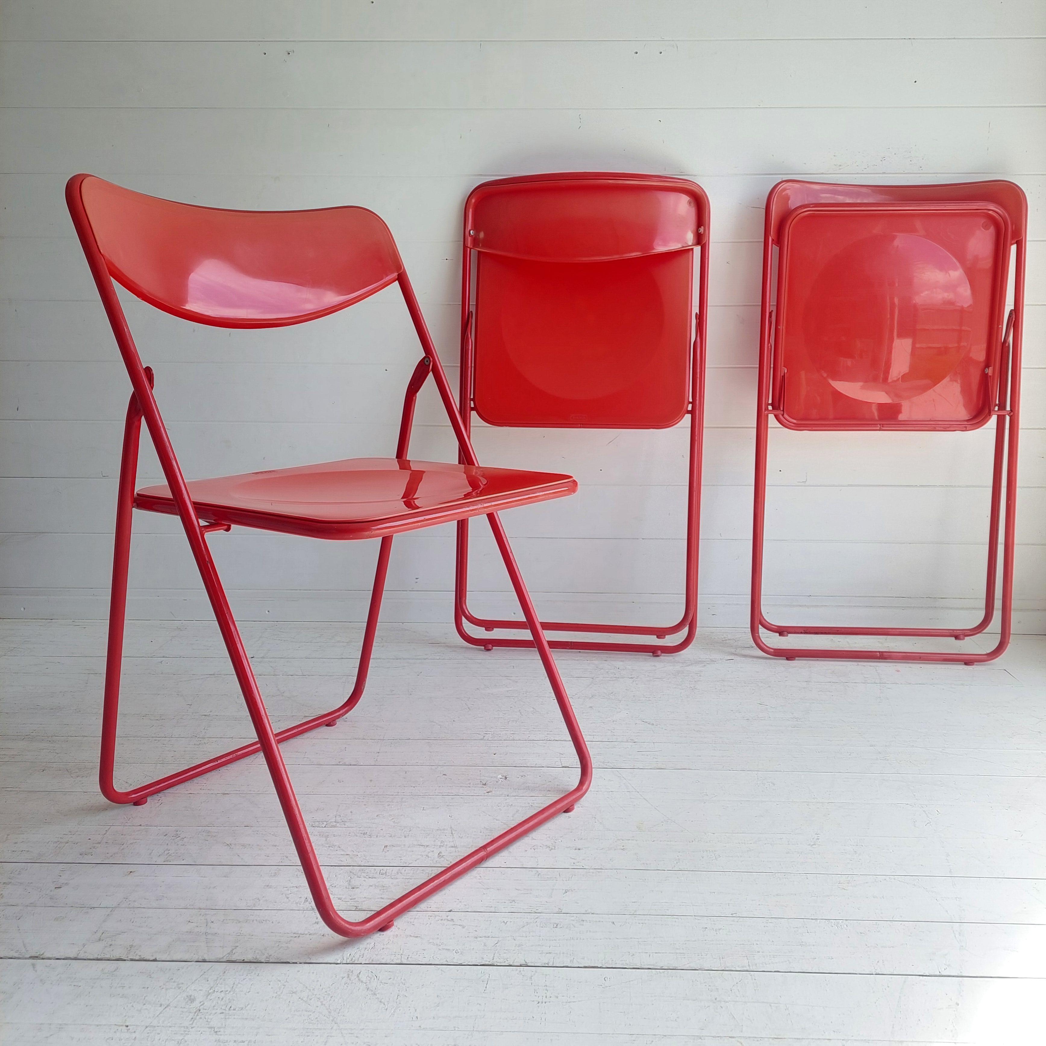 Timeless Ted folding chairs by Niels Gammelgaard for IKEA from the 1970s in red.
Original Ikea 70's chairs
High-quality metal frame with backrest and plastic seat.
The TED Chair, by Niels Gammelgaard for IKEA was in production from the 1970's until