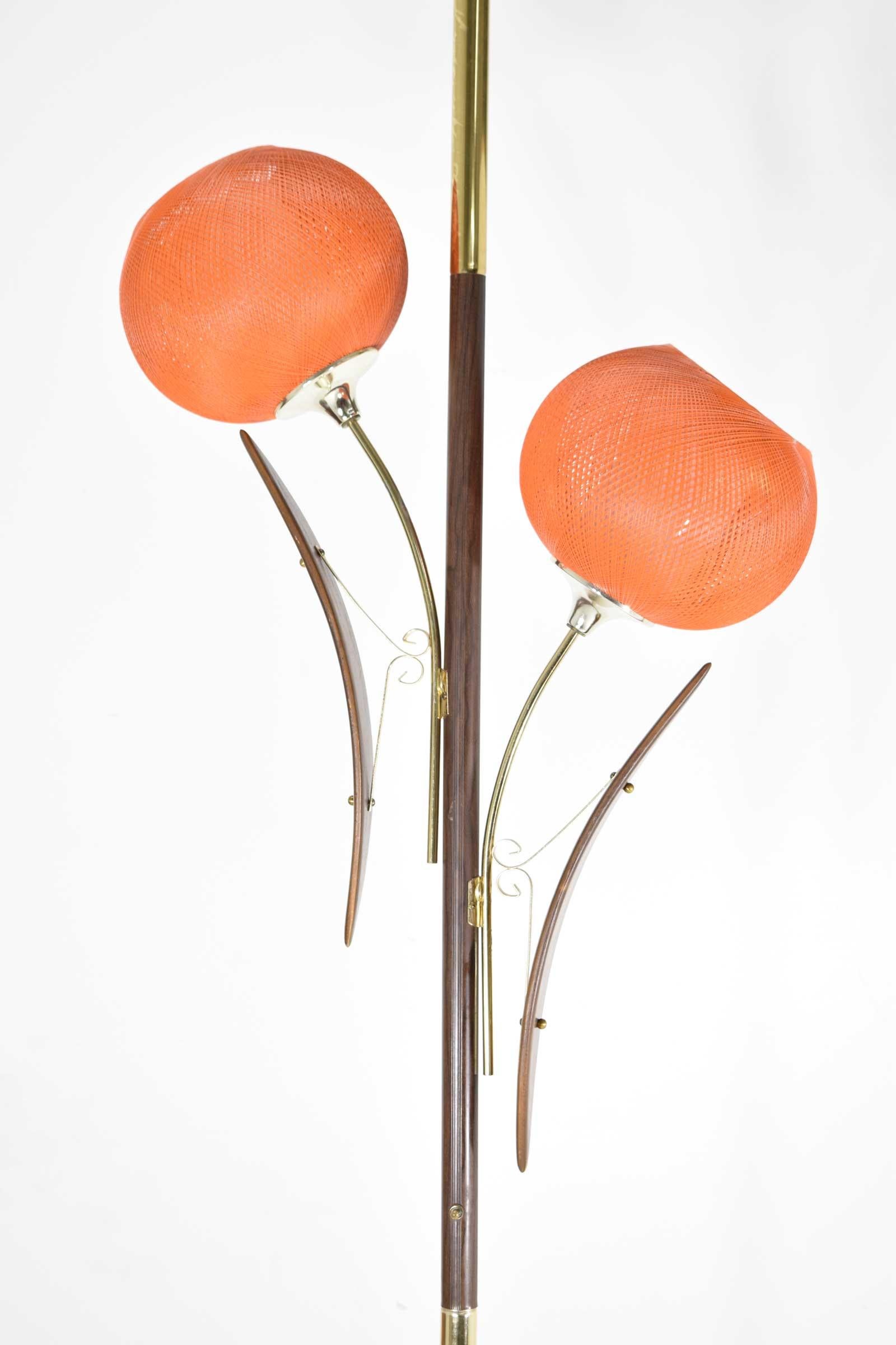 A really nice decorative midcentury tension pole lamp with orange spun fiberglass shades. Three way switch.