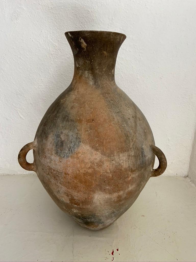 1960s ceramic water pot with 3 rope handles from the northern highlands of Puebla. The vase is from an indigenous Popoloca community.