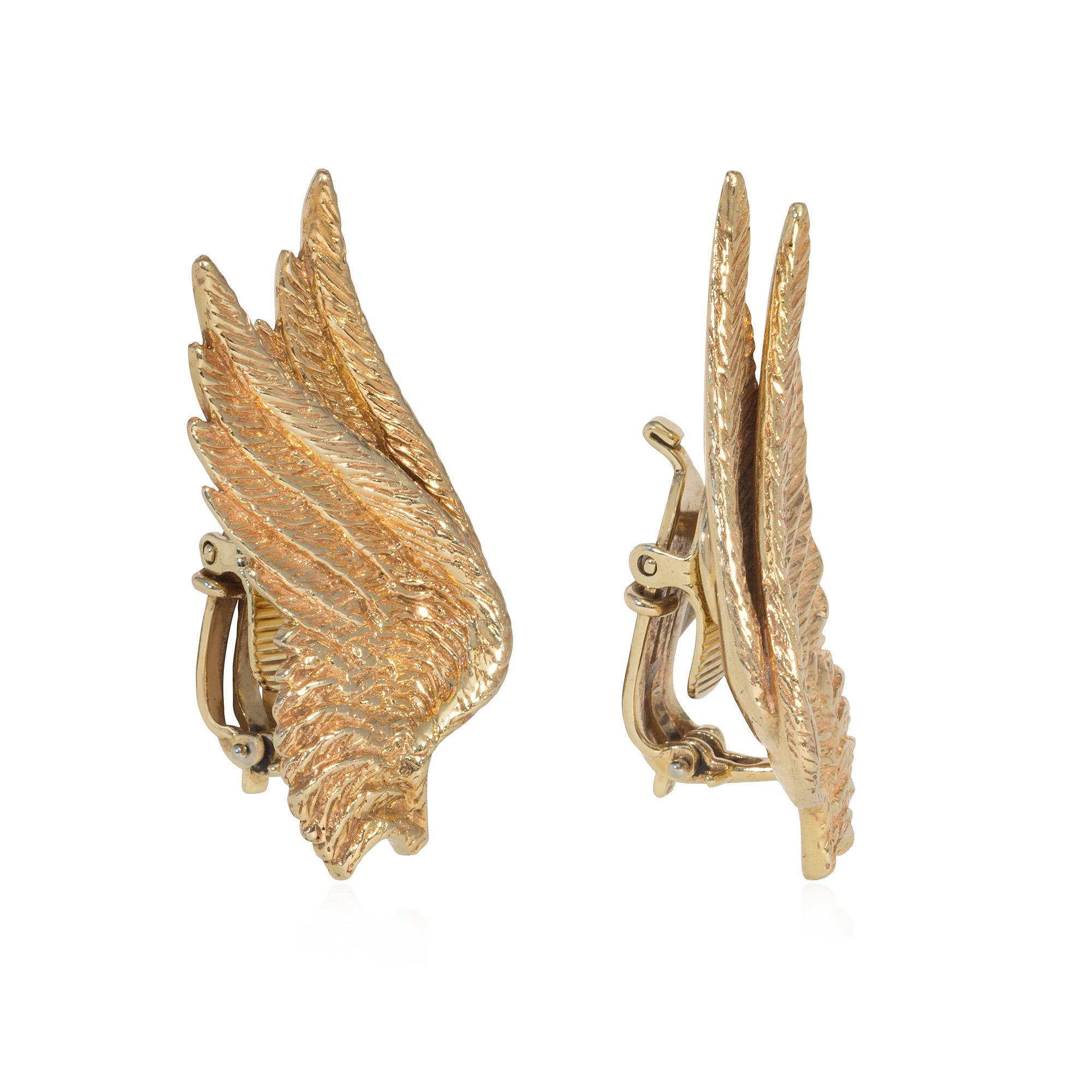 A pair of mid-century textured gold clip earrings, each earclip designed as finely detailed overlapping angel wings, in 14k. Clips are marked Pat. #2423905, which is associated with Tiffany & Co. and Cartier NY.

* Includes letter of authenticity
