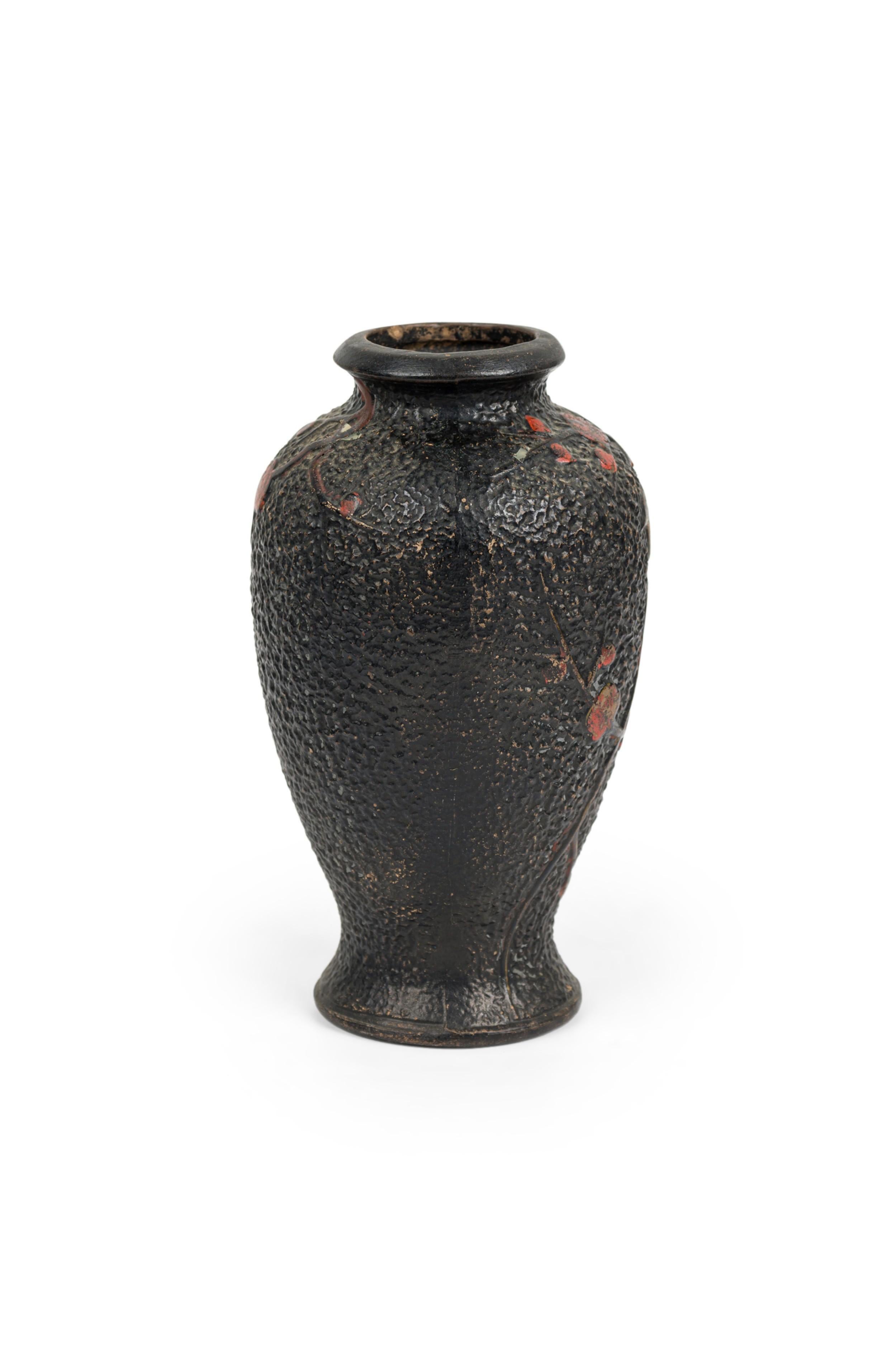 Mid-Century textured black ceramicurn with a bird sitting on a branch with red flowers