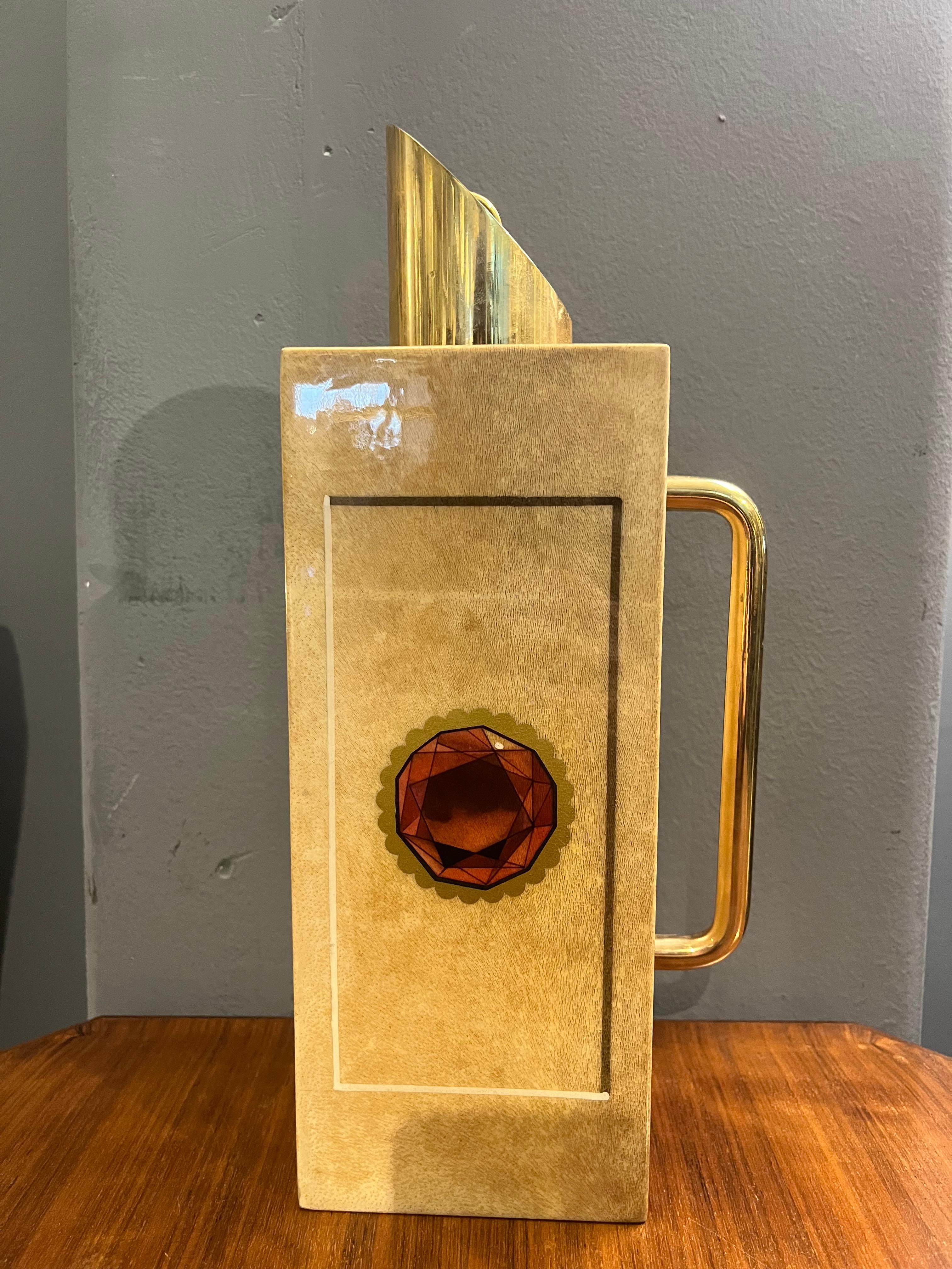 Mid-century thermal flask in brass and goatskin by Aldo Tura. For sale an elegant and rare vintage carafe/bar by Aldo Tura, a masterpiece of Italian design from the 60s-70s. Made with the characteristic lacquered parchment leather finish, this
